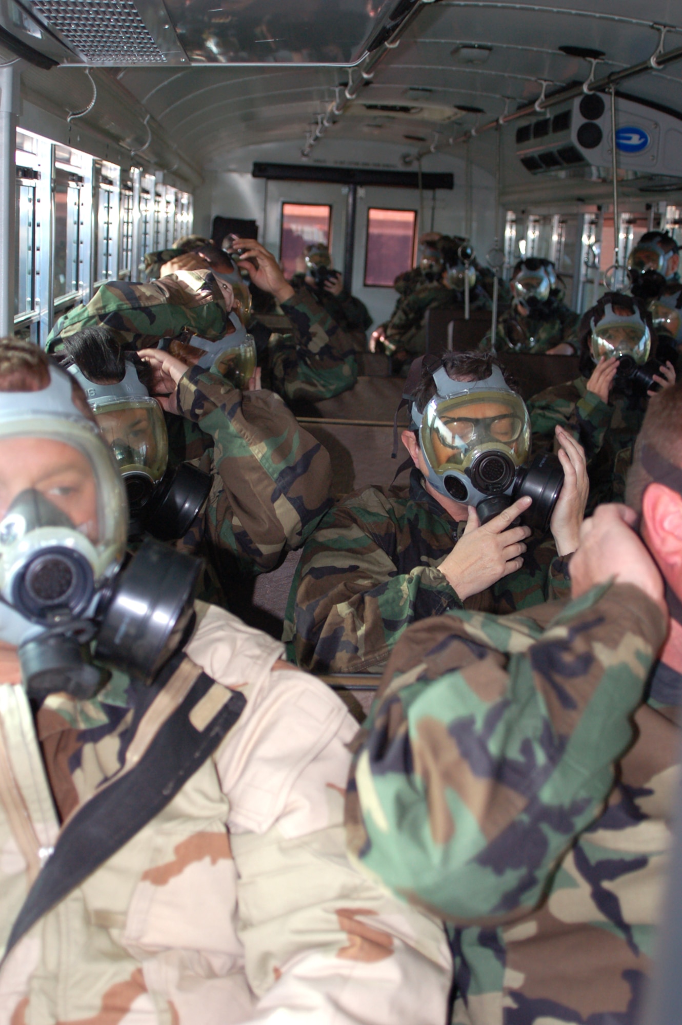 Students in an April 17 81st Medical Group medical unit readiness training exercise put on their gas masks during a simulated chemical attack.  The 26 personnel, all in AEFs 7 and 8, took part in the training to prepare for possible deployment to Southwest Asia.  (U.S. Air Force photo by Photos by Steve Pivnick)
