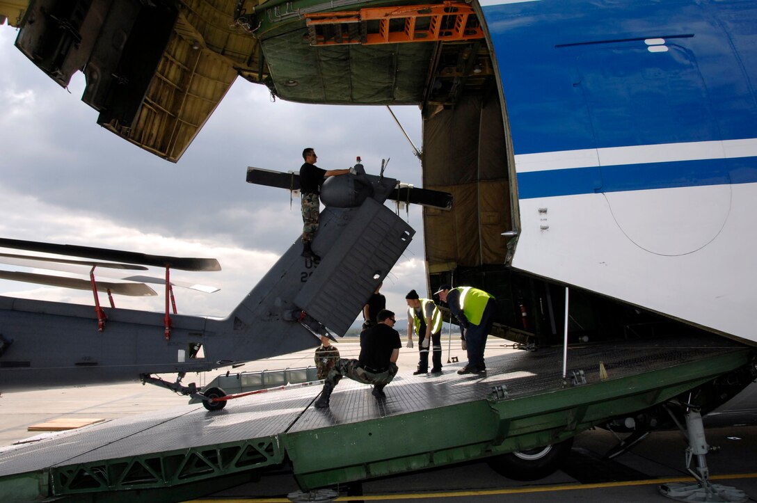 Airmen from the 129th Rescue Wing load a HH-60G Pave Hawk rescue helicopter onto a Russian Volga-Dnepr AN-124 long-range heavy transport aircraft April 20 at Moffett Federal Airfield, Calif. The contracted AN-124 transported 129th Rescue Wing deployment cargo to Afghanistan because the high operations tempos of Operations Iraqi Freedom and Enduring Freedom have kept C-17 Globemaster III and C-5 Galaxy aircraft fully engaged. (U.S. Air Force photo/Senior Master Sgt. Christopher Hartman)