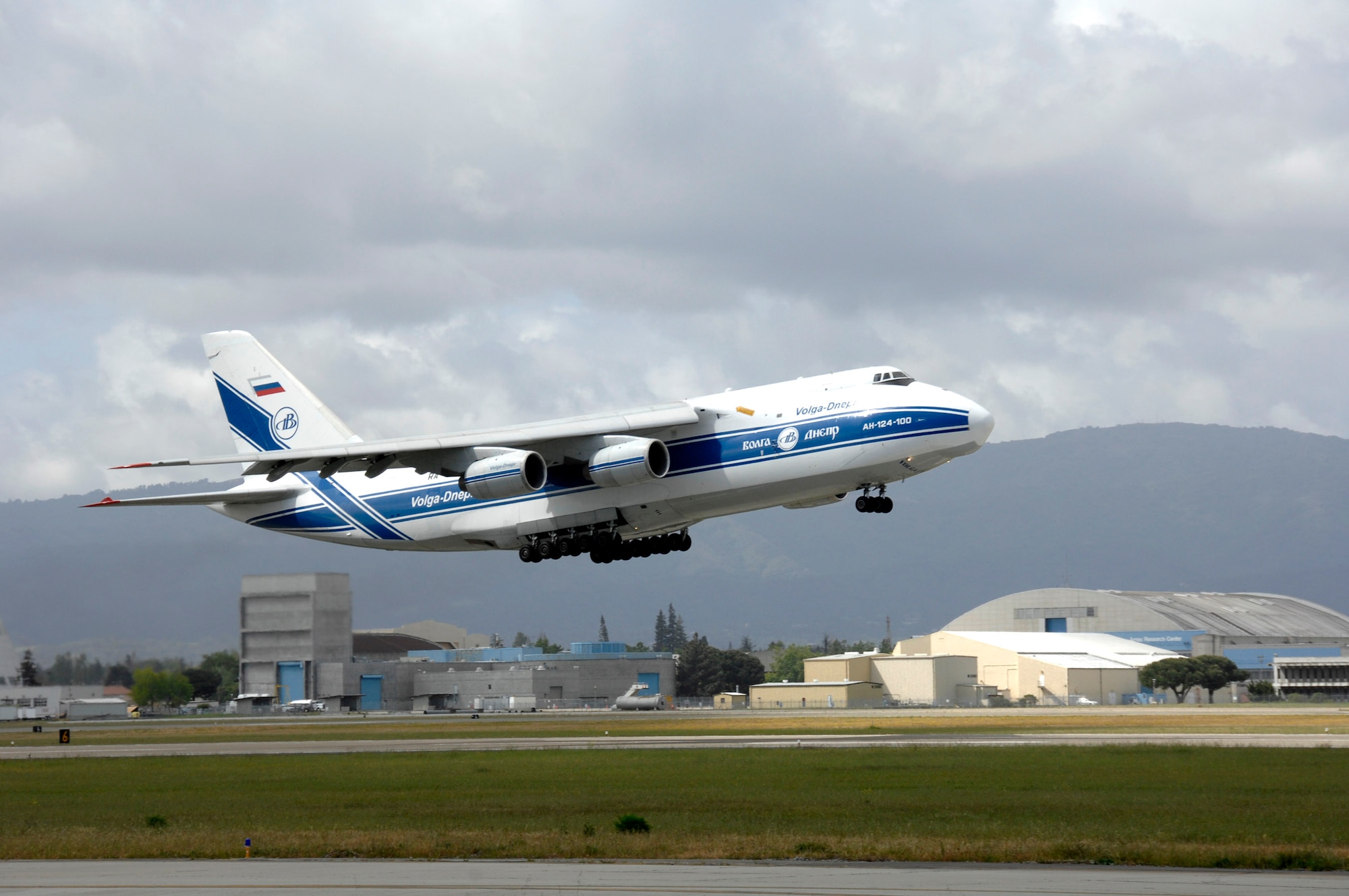 A Russian Volga-Dnepr AN-124 long-range heavy transport aircraft takes off from Moffett Federal Airfield, Calif., April 22. The contracted AN-124 transported 129th Rescue Wing deployment cargo to Afghanistan because the high operations tempos of Operations Iraqi Freedom and Enduring Freedom have kept C-17 Globemaster III and C-5 Galaxy aircraft fully engaged. (U.S. Air Force photo/Master Sgt. Daniel Kacir)