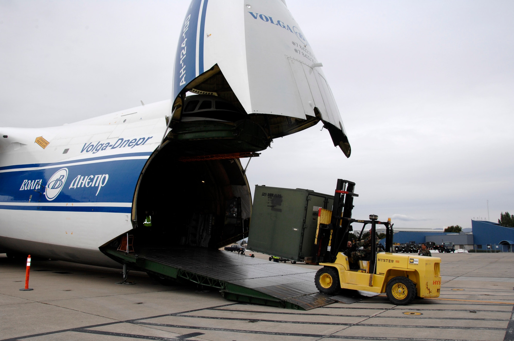 Airmen from the 129th Rescue Wing load cargo onto a Russian Volga-Dnepr AN-124 long-range heavy transport aircraft April 21 at Moffett Federal Airfield, Calif. The contracted AN-124 transported 129th Rescue Wing deployment cargo to Afghanistan because the high operations tempos of Operations Iraqi Freedom and Enduring Freedom have kept C-17 Globemaster III and C-5 Galaxy aircraft fully engaged. (U.S. Air Force photo/Master Sgt. Daniel Kacir)