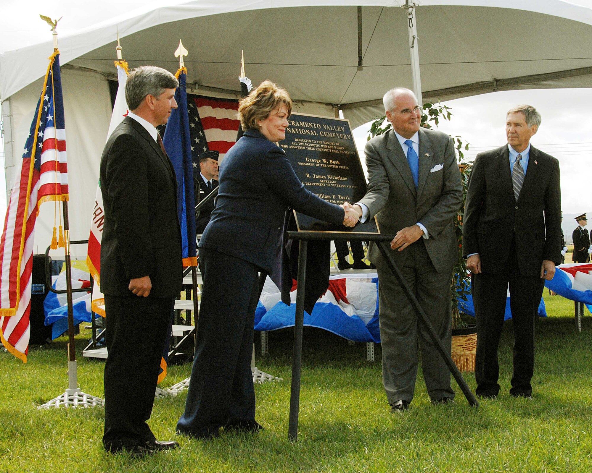 Representative Ellen Tauscher, (D-Calif.), and Mr. William Tuerk, Under Secretary for Memorial Affairs, shake hands after the unveiling of the dedication plaque during the Sacramento Valley Veterans Affairs National Cemetery dedication ceremony April 22 in Dixon, Calif. (U.S. Air Force photo by David Cushman)