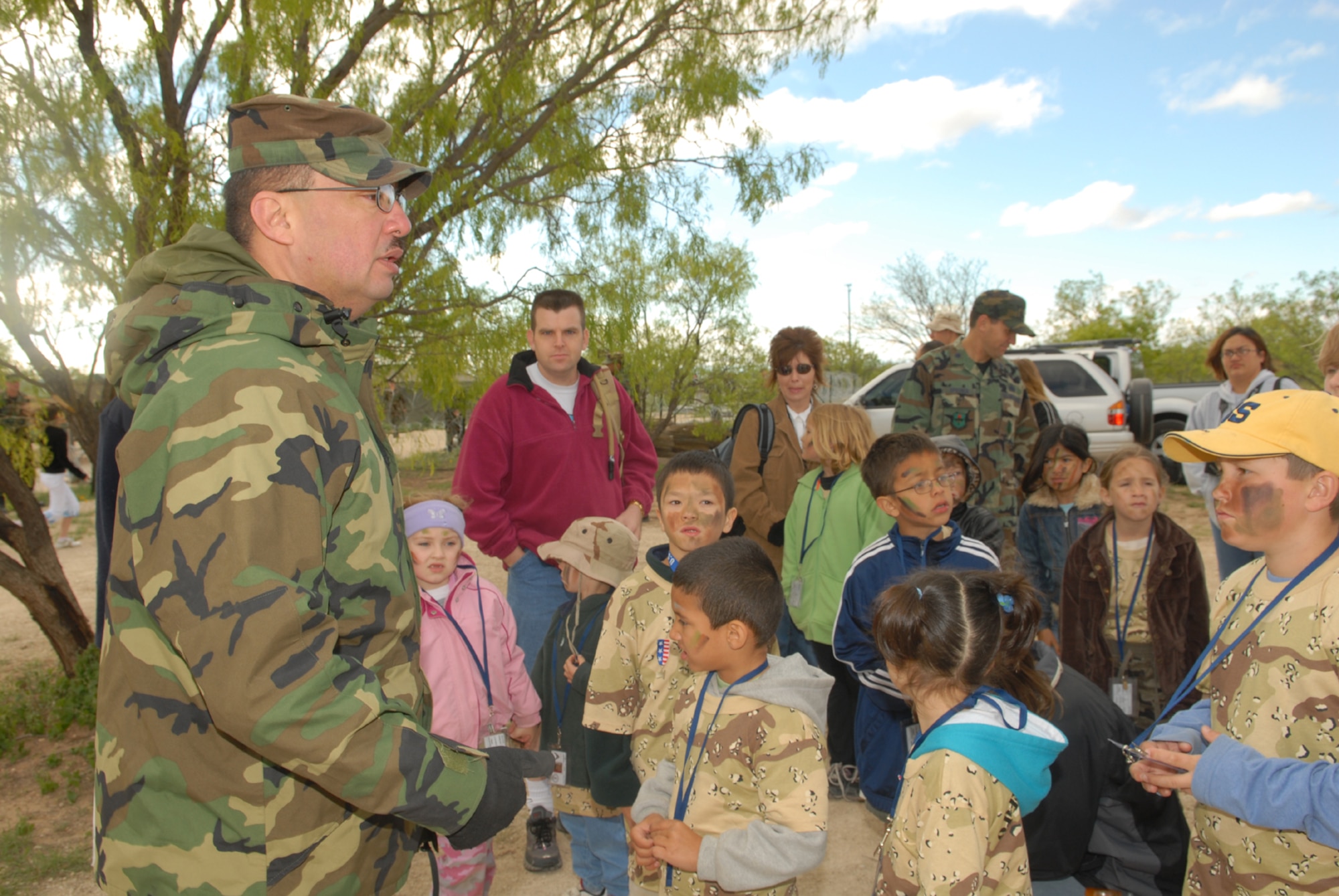 Master Sgt. Victor DeLaRosa, an Operation KIDS volunteer, gives an initial safety briefing to a group of Operation KIDS deployees at Discovery Air Base. (U.S. Air Force photo by Airman 1st Class Kamaile Chan)