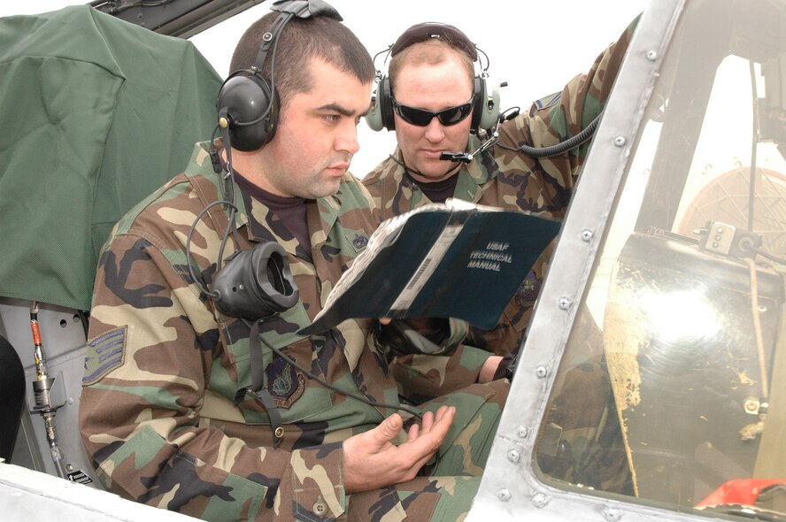 OSAN AIR BASE, Republic of Korea -- Staff Sgt. Chet Oleske, 25th Aircraft Maintenance Unit crew chief, performs a system check on an A-10 using the jet’s auxiliary power unit while Master Sgt. Jeffery Boot, 51st Maintenance Operations Squadron APU A-10 instructor, looks on Tuesday.