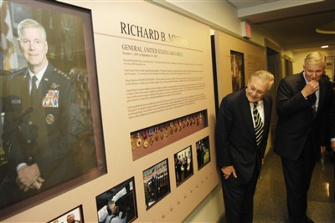 Former Defense Secretary Donald H. Rumsfeld and retired U.S. Air Force Gen. Richard B. Myers, former chairman of the Joint Chiefs of Staff, view the general's legacy board after it was unveiled  in the Pentagon,  April 24, 2007. 