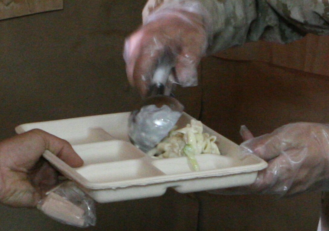 COMMAND OUTPOST NORSEMAN, RUTBAH, Iraq ? Marines at Command Outpost Norseman are served two hot meals a day. Some of the items they have grown to love are the shrimp scampi, pot roast and chicken alfredo.