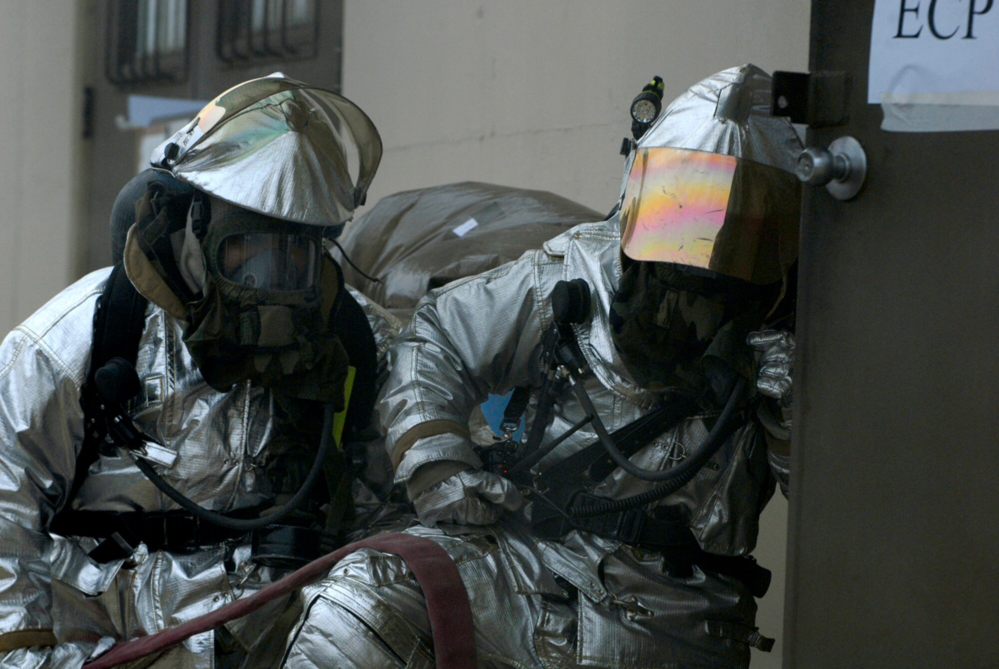 KUNSAN AB, Republic of Korea ? Firefighters from the 8th Civil Engineer Squadron responds to a simulated fire during an exercise scenario here April 17. The 8th Fighter Wing is currently undergoing an operational readiness inspection to test its ability to conduct its wartime mission. (U.S. Air Force photo by Senior Airman Darnell T. Cannady)  