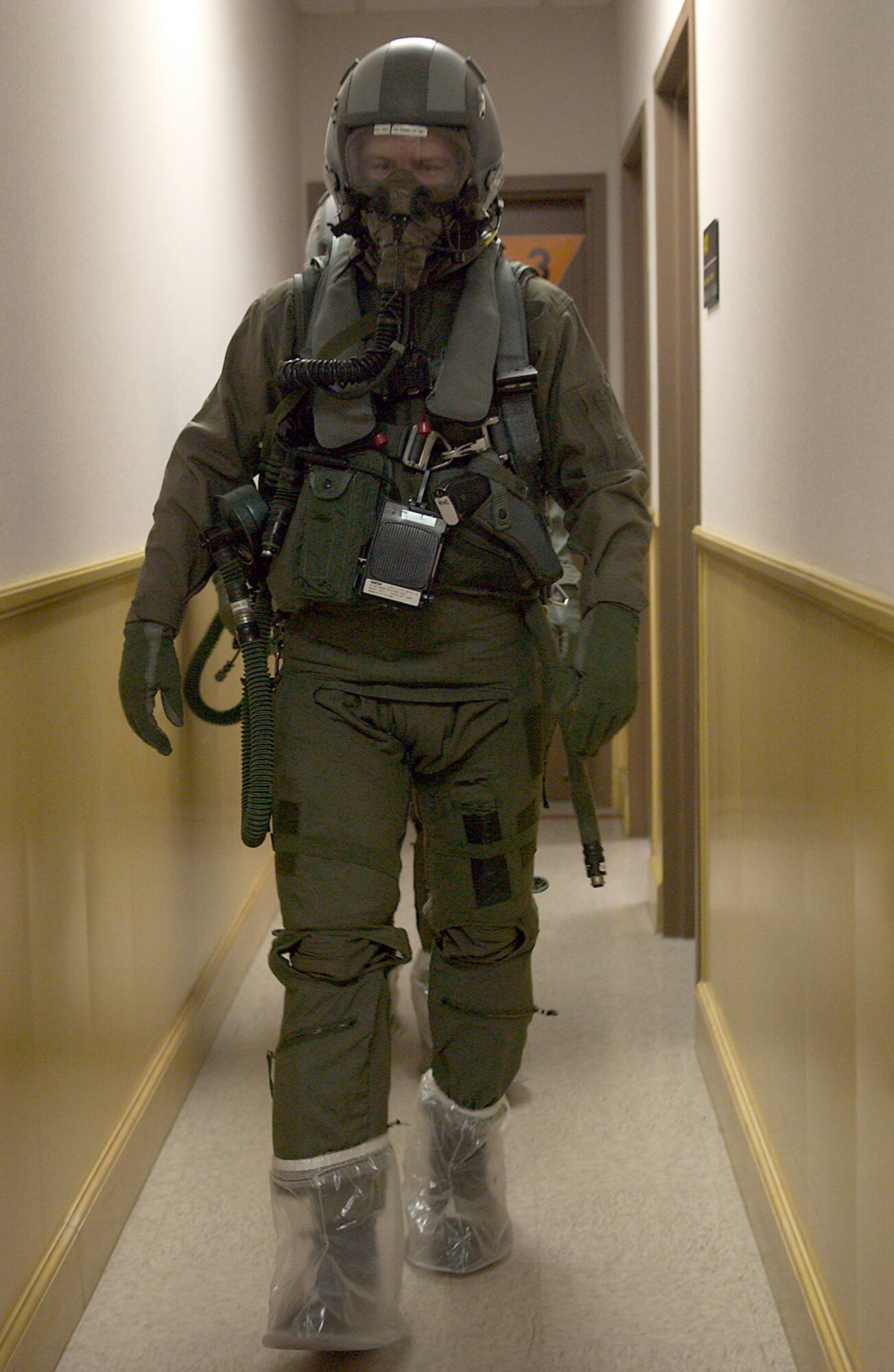 KUNSAN AB, Republic of Korea -- 1st Lt Trevor Callens, 80th Fighter Squadron, wears an Aircrew Eye Respiratory Protection System during an operational readiness inspection here April 16. All aircrew members stop at the 80th Life Support Section to check out their equipment prior to their flight. Their lives depend on the serviceability and operability of the equipment and the Life Support Section?s primary mission is to ensure the equipment is ready. The 8th Fighter Wing is currently undergoing an ORI to test its ability to conduct its wartime mission. (U.S. Air Force Photo by Senior Airman Barry Loo.)