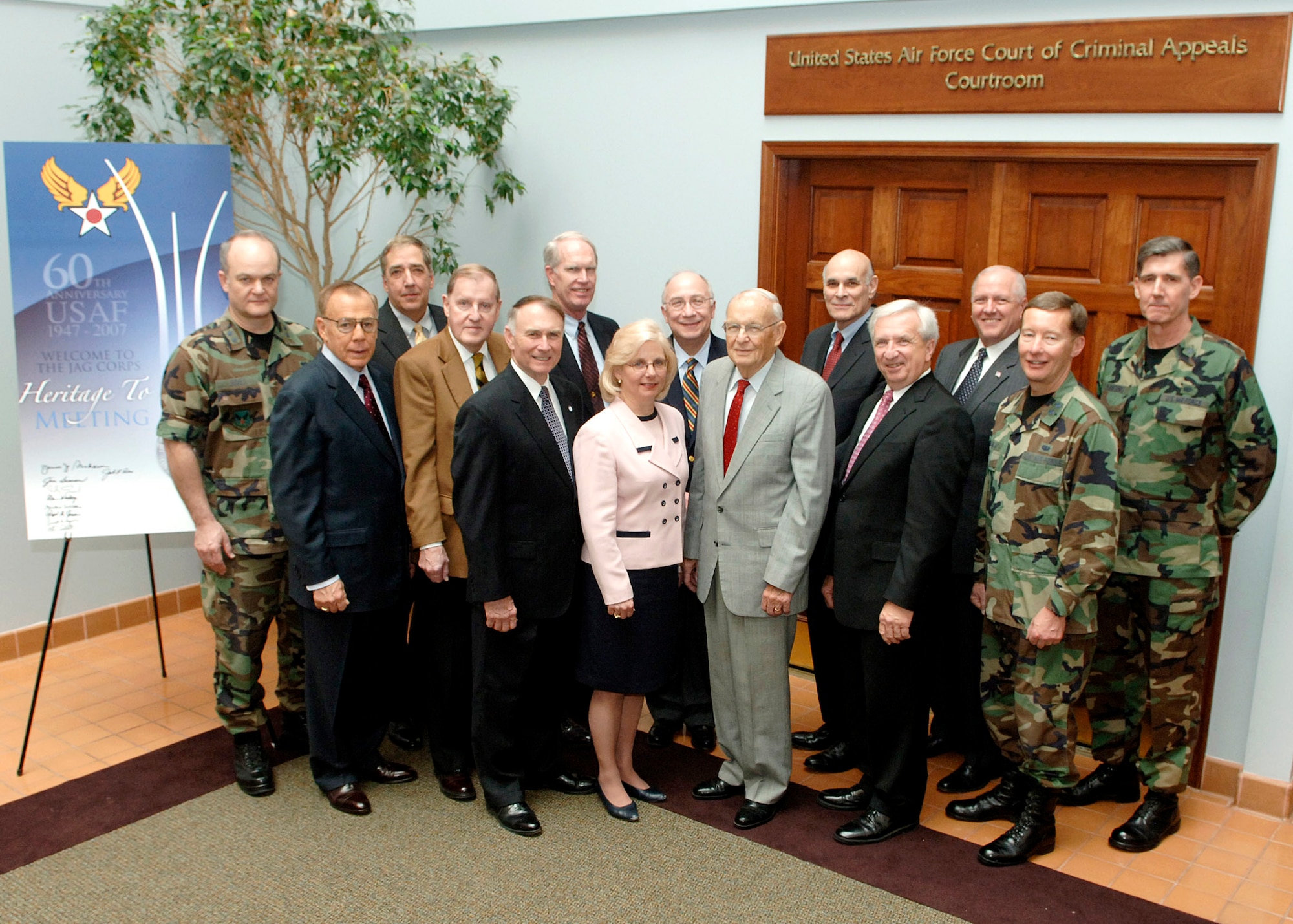 Maj. Gen. Jack L. Rives (left), the Air Force Judge Advocate General, hosted a "Heritage to Horizon" meeting recently at Bolling AFB, D.C., along with Maj. Gen. Charles J. Dunlap Jr. (near right), the deputy JAG, and Brig. Gen. Richard C. Harding (far right), selected to command the Air Force Legal Operating Agency at Bolling AFB.  Eleven JAG Corps leaders, all retired general officers or Senior Executive Service civilians, gathered to discuss the way ahead for the corps.  (U.S. Air Force photo/Thomas Dennis)