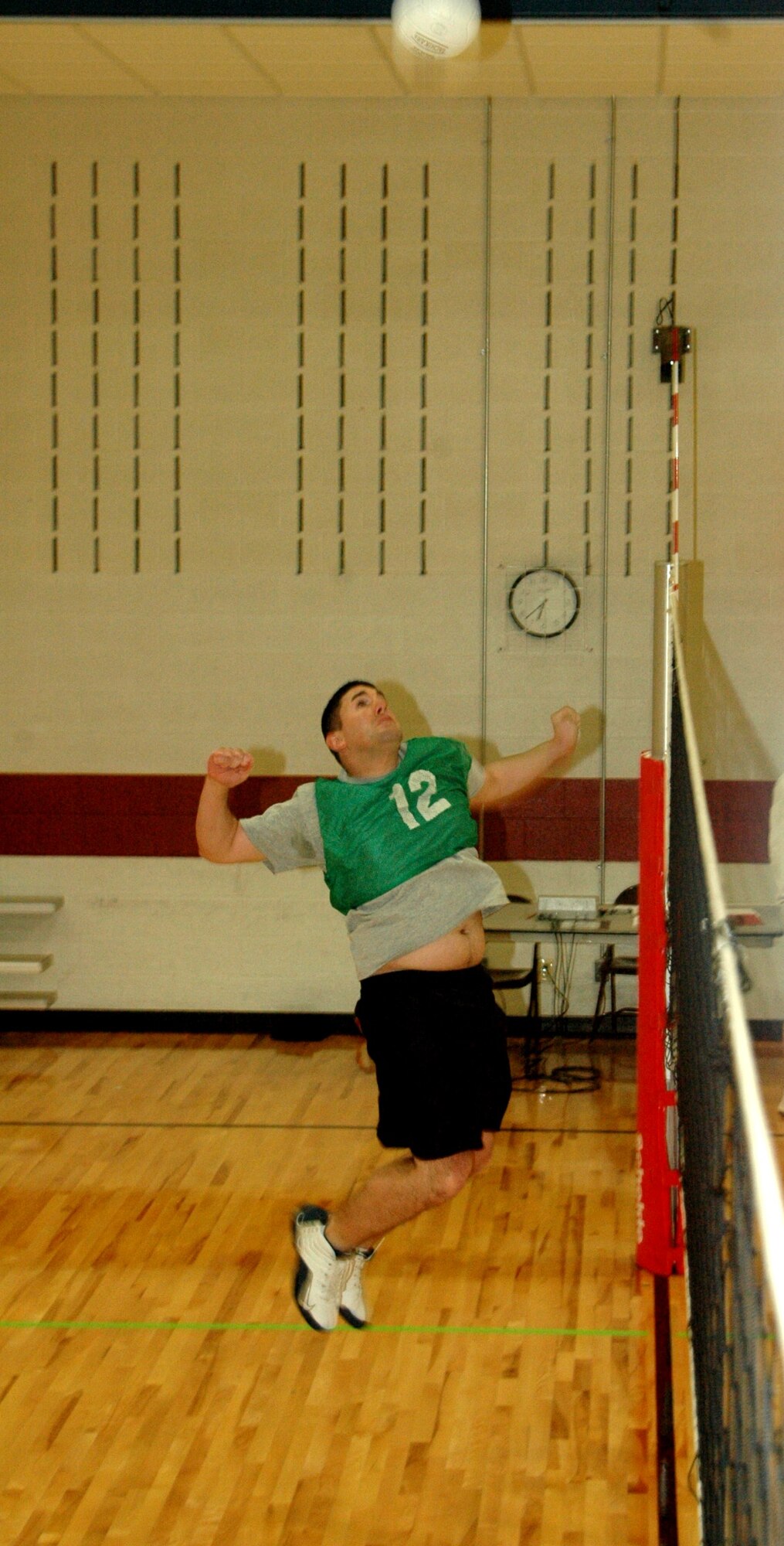 Members from the 28th Communications Squadron take on members from the 28th Munitions Squadron in an intramural volleyball match here at the Bellamy Fitness Center on April 24.  The 28th CS won the match by beating the 28th MUNS in the first 2 games.  (U.S. Air Force photo/Tech. Sgt. Todd Wivell)