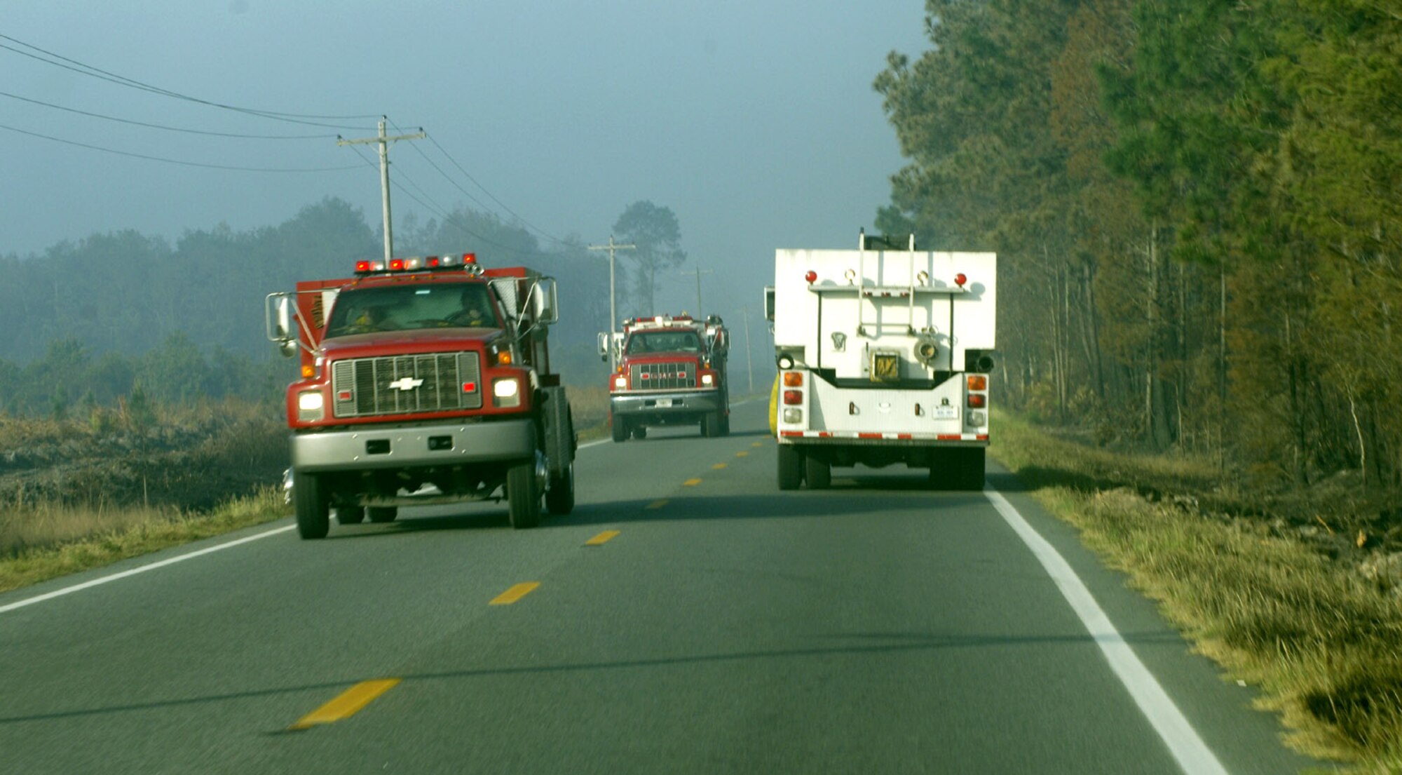Moody Air Force Base firefighters rush to the scene of a spreading fire April 21 that swept through rural southeastern Georgia. The 23rd Civil Engineer Squadron Fire and Emergency Services Flight are helping support local fire departments by ensuring they have sufficient amounts of water to put out the fires. By using tankers that can hold 5,000 gallons of water, up to five fire trucks can be filled. (U.S. Air Force photo/Senior Airman Javier Cruz)