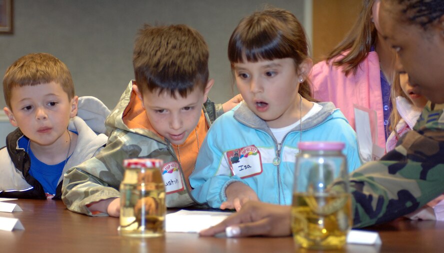 A1C Amada Daniels, 75th Mission Support Squadron, gets some surprised looks while showing a Brown Bat to (left to right) Jadyn Cutler, Austin Schlegel and Isa Thomas. Photos by Alex R. Lloyd
