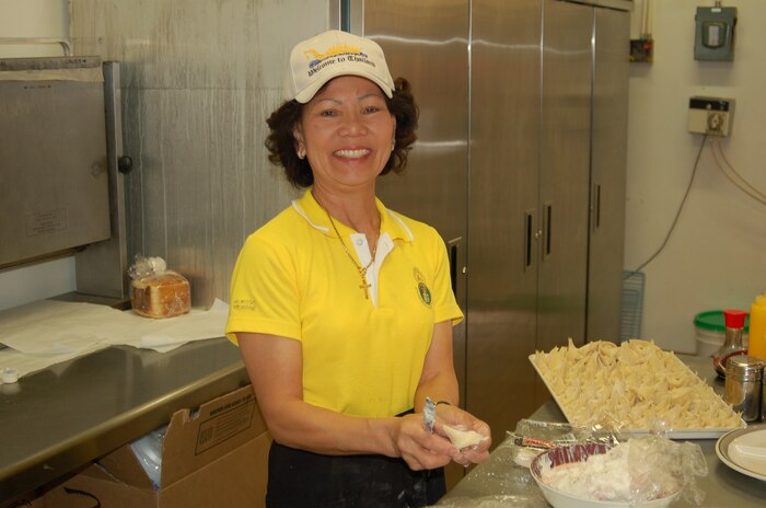 Bunjob Turner, an owner of the Five Star Restaurant & Grill, prepares crab wontons for the daily buffet. Mrs. Turner and her husband, Brett, operate the restaurant in Bldg. 849. Menu items include a Thai and Chinese buffet, hamburgers and breakfast. Photos by Bill Orndorff
