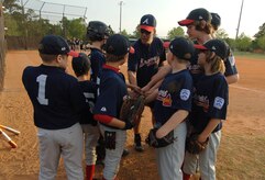 Mike Daniel gives some coaching to the Charleston AFB Braves during their game against the Summerville Majors Wednesday. (U.S. Air Force photo/Staff Sgt. April Quintanilla)