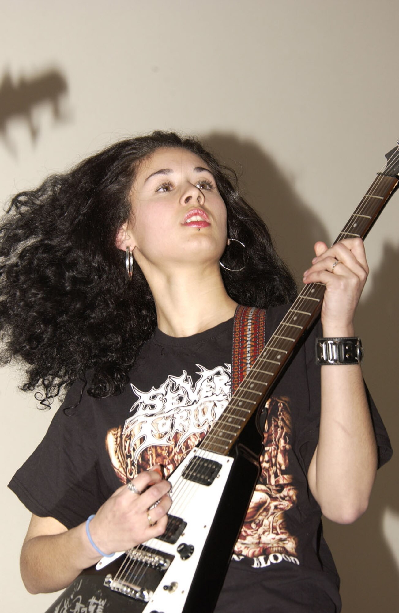 SPANGDAHLEM AIR BASE, GERMANY – Athena Gastelum, Monotor lead guitarist, performs at the Spangdahlem Skyline prior to the special premier of “300” for an audience of more than 250 people. The staff at the Skyline has more bands on tap for this summer as pre-movie entertainment and stand alone concert performances, along with special give-a-way. (US Air Force photo/Staff Sgt. Ray Mills)