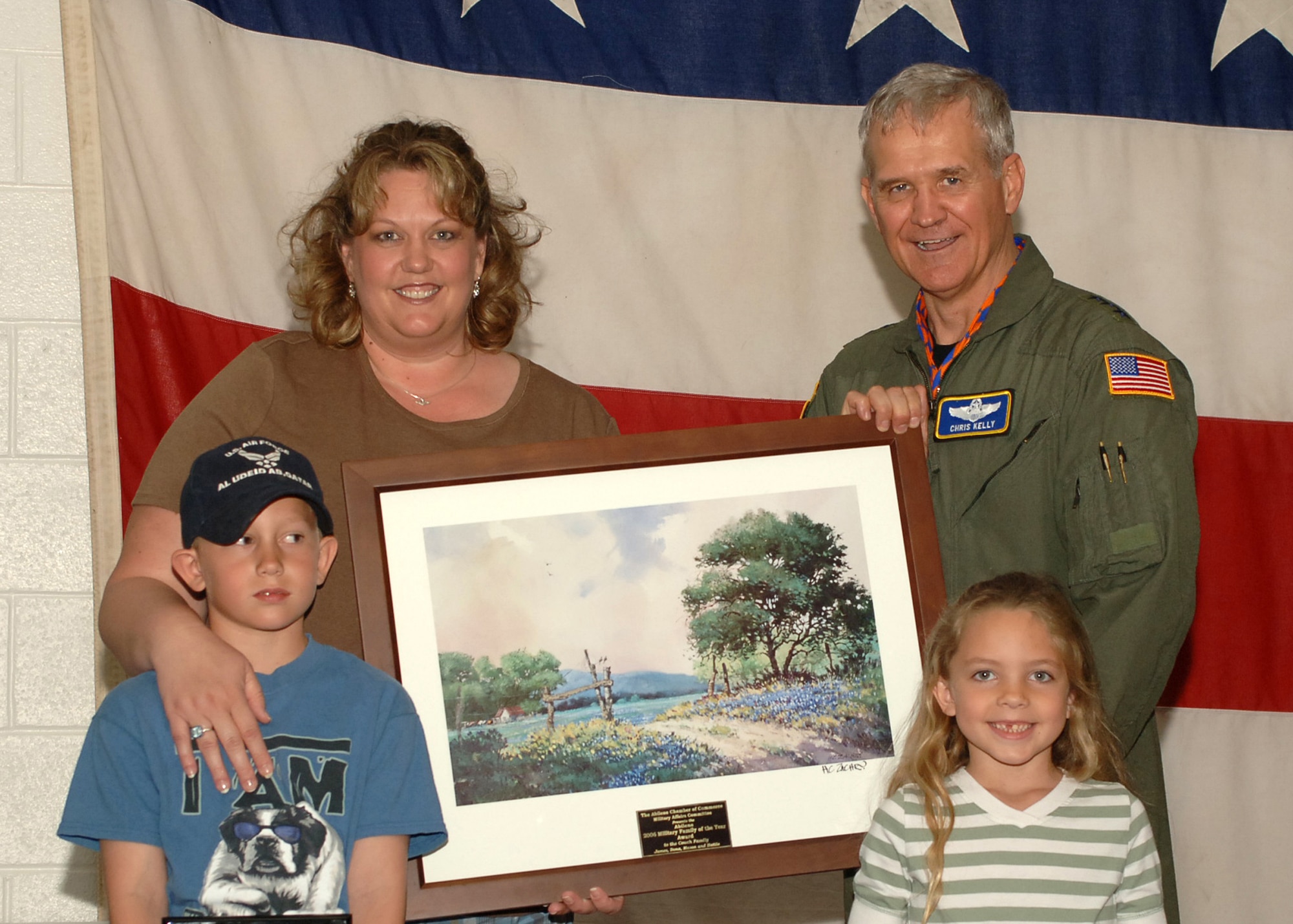 Lt. Gen. Chris Kelly, Air Mobility Command vice commander, announces the Couch family as the Military Family of the year at The Worlds Largest BBQ April 21. The Worlds Largest BBQ is held at the Abilene Civic Center annually in honor of military personnel. (U.S. Air Force photo by Airman 1st Class Felicia Juenke)