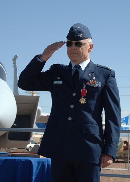 Col. Matthew Adkins, 49th Medical Group commander, gives a final salute to the crowd at his retirement ceremony April 23 at Holloman Air Force Base after nearly 30 years of military service. (U.S. Air Force photo by Airman 1st Class Jamal Sutter)