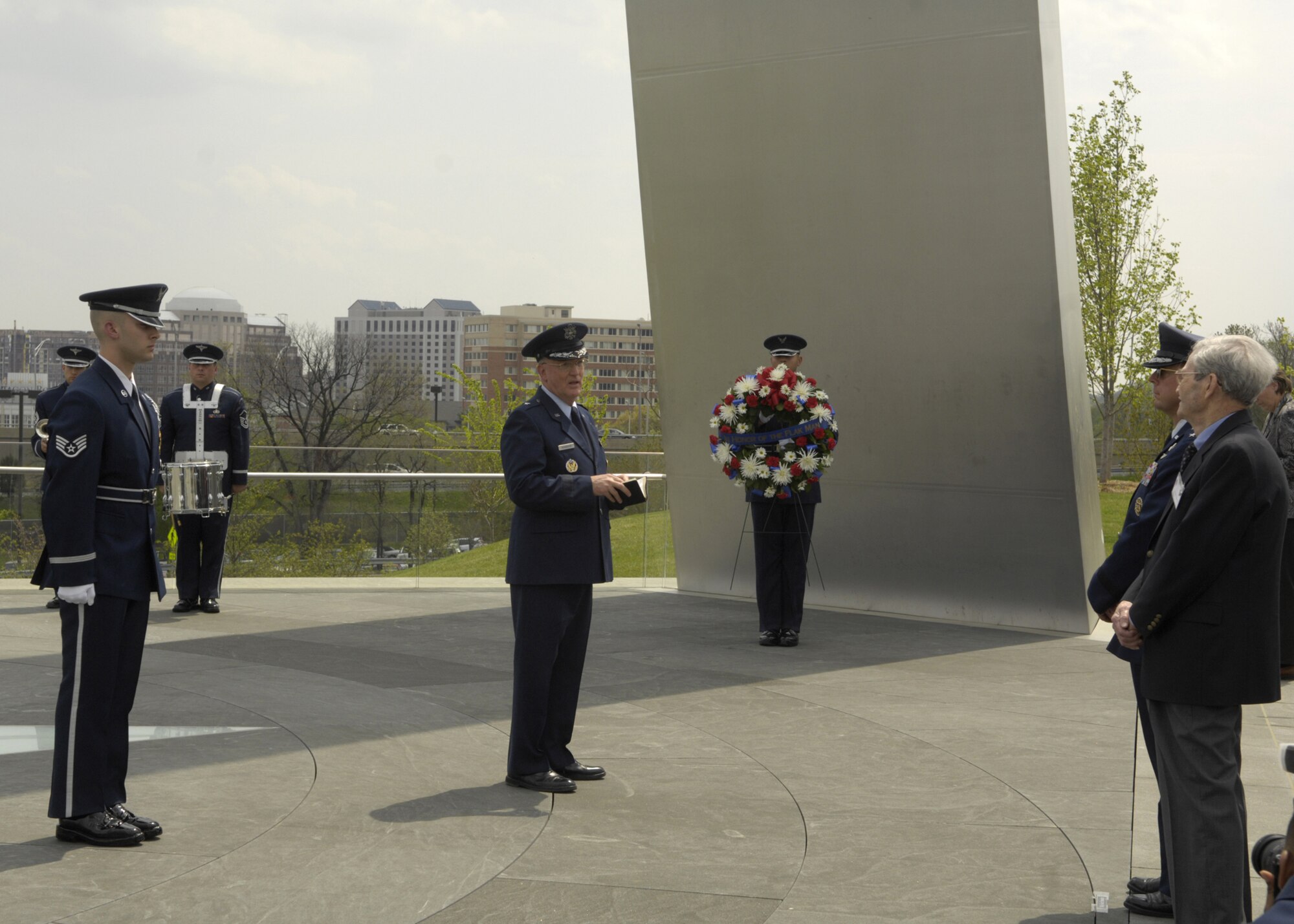 Chaplain (Brig. Gen.) Cecil R. Richardson gives the invocation during a wreath-laying ceremony in honor of the Flak Man crew at the Air Force Memorial, Arlington, Va., April 24. The wreath was placed by Edward McNally, the Bombardier of the B-24 Bomber, The Flak Man, in honor of the former crew members of the Flak Man who dedicated their lives to the cause of freedom. (U.S. Air Force photo by Senior Airman Rusti Caraker)