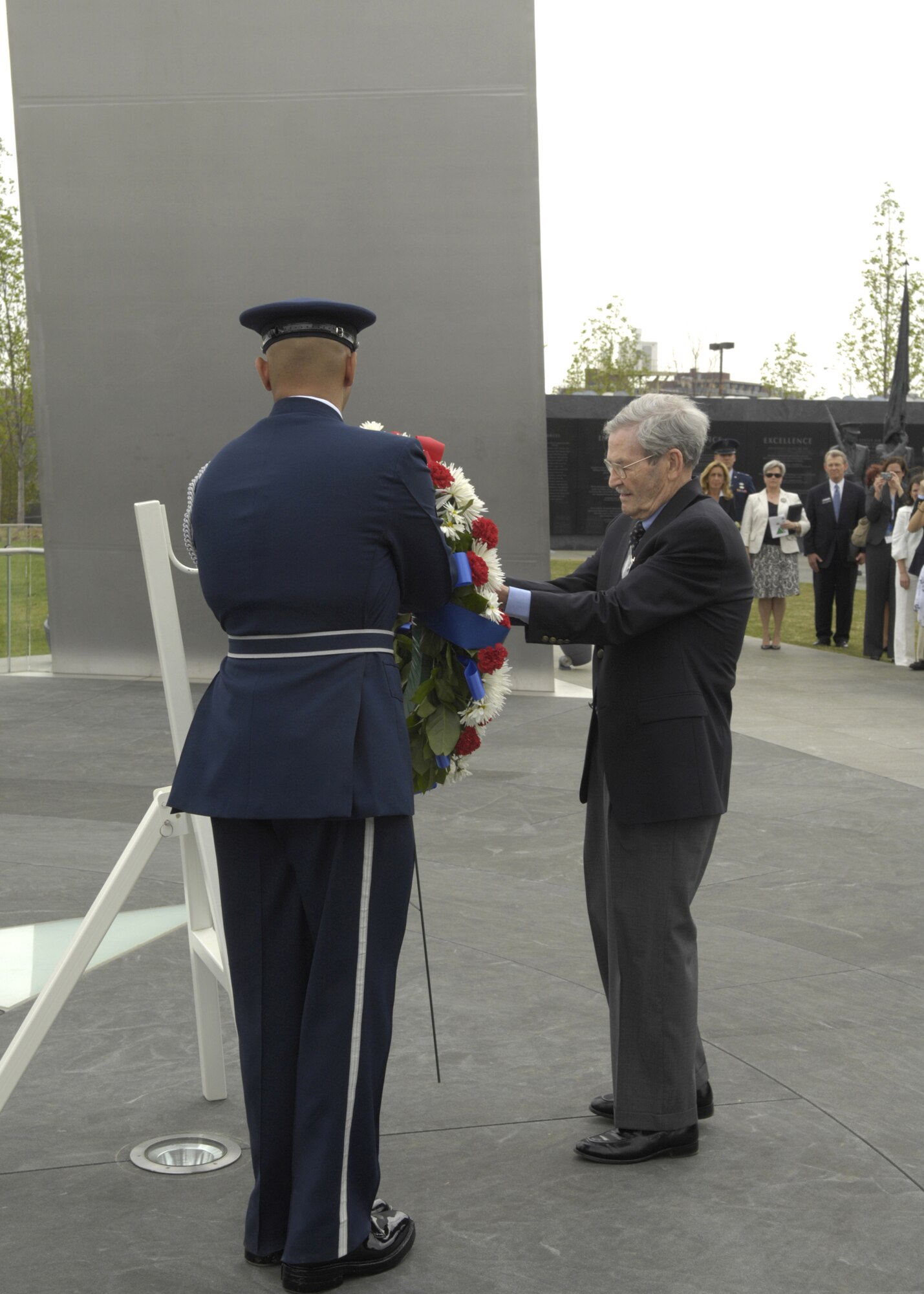 Family and friends gather in memory of the Flak Man crew, after a wreath-laying ceremony at the Air Force Memorial, Arlington, Va., April 24. The wreath was placed by Edward McNally, the Bombardier of the B-24 Bomber, The Flak Man, in honor of the former crew members of the Flak Man who dedicated their lives to the cause of freedom. (U.S. Air Force photo by Senior Airman Rusti Caraker)