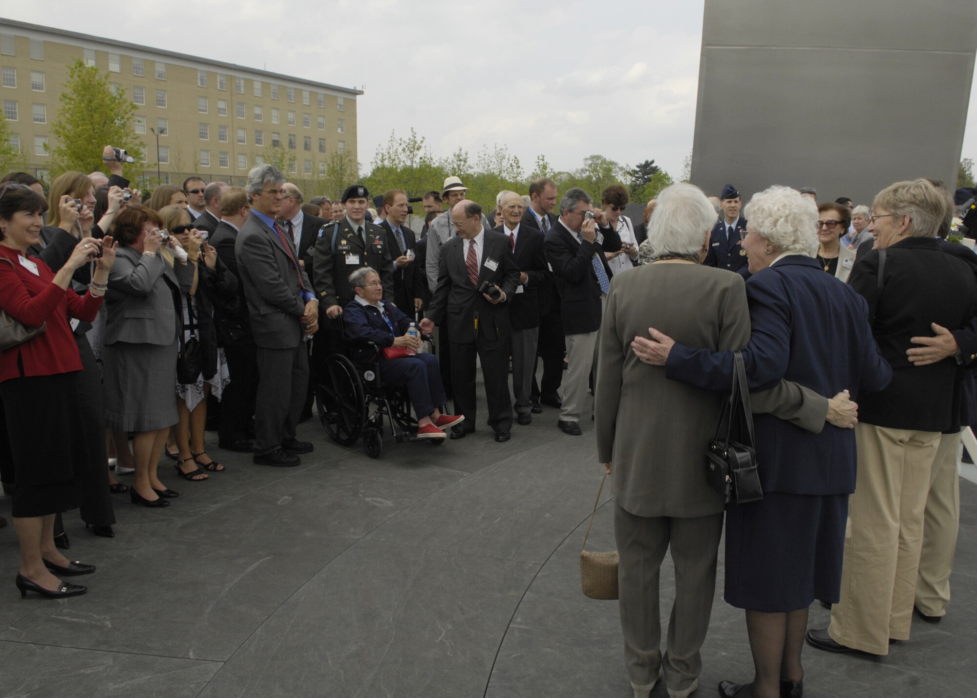 Family and friends gather in memory of the Flak Man crew, after a wreath-laying ceremony at the Air Force Memorial, Arlington, Va., April 24. The wreath was placed by Edward McNally, the Bombardier of the B-24 Bomber, The Flak Man, in honor of the former crew members of the Flak Man who dedicated their lives to the cause of freedom. (U.S. Air Force photo by Senior Airman Rusti Caraker)