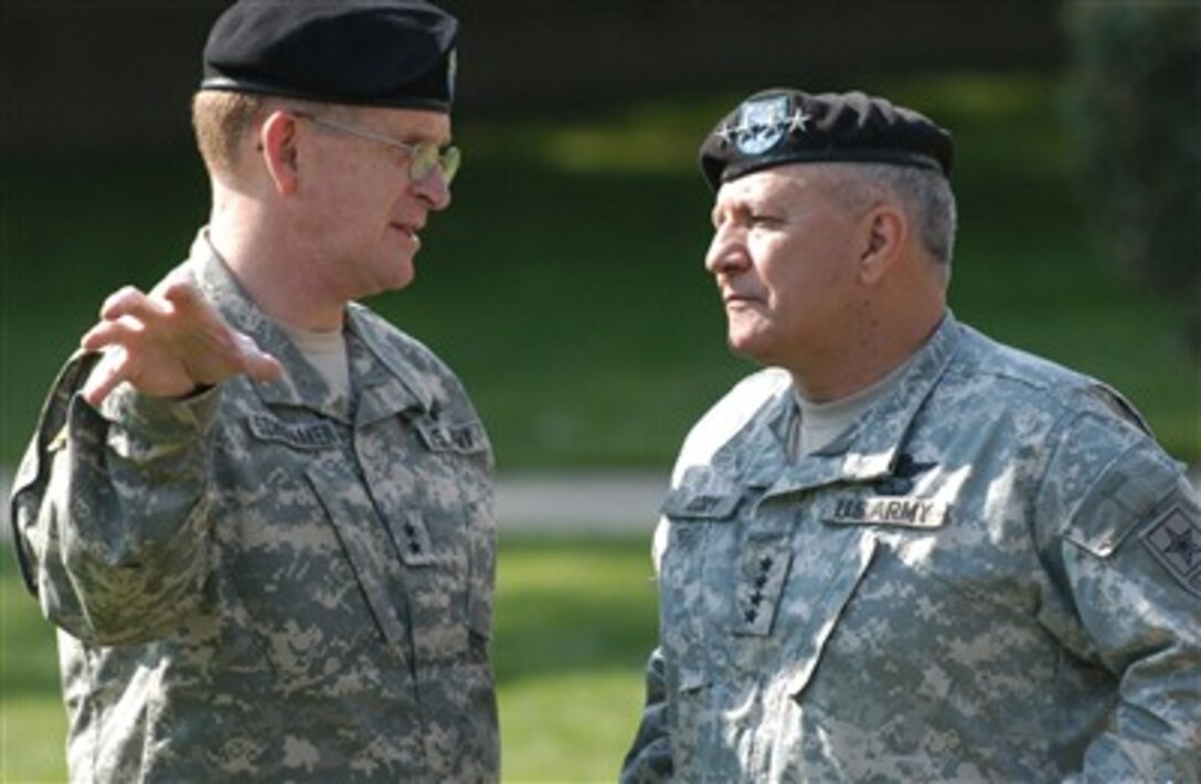 Army Maj. Gen. Eric B. Schoomaker, commander of North Atlantic Regional Medical Command and Walter Reed Army Medical Center, talks with Army Vice Chief of Staff Gen. Richard A. Cody before the activation ceremony of the Warrior Transition Brigade at Walter Reed, April 25.