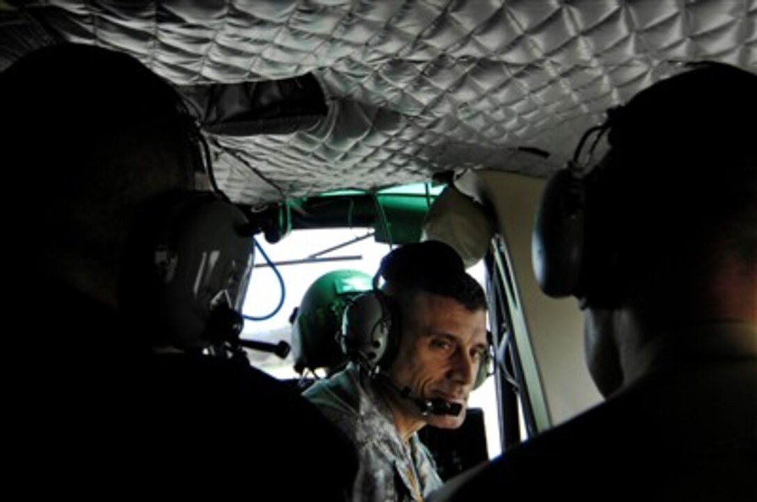 Commandant of the United States Military Academy at West Point Brig. Gen. Robert Casien talks to Chairman of the Joint Chiefs of Staff U.S. Marine Corps Gen. Peter Pace as they fly onboard a UH1 helicopter to West Point, N.Y., April 25, 2007. 