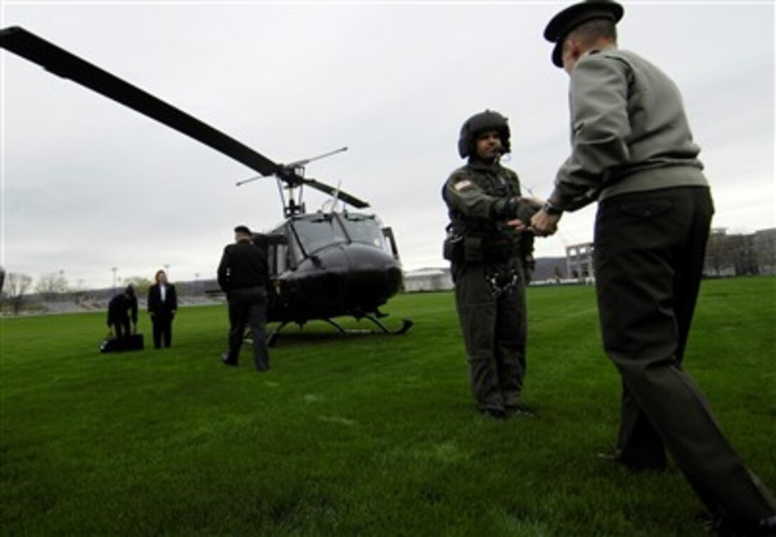 Chairman of the Joint Chiefs of Staff U.S. Marine Corps Gen. Peter Pace greets a U.S. Army crew chief before he departs West Point, N.Y. on an Army UH1 helicopter,  April 25, 2007. 