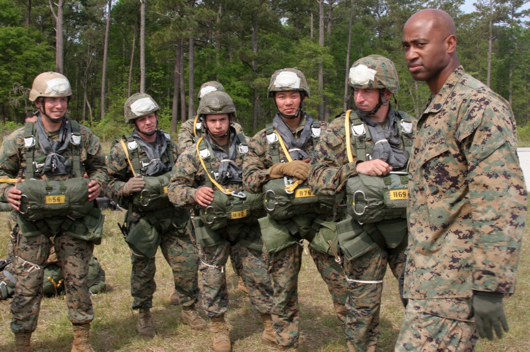 Sgt. James J. Creel, an infantryman currently assigned as the Anti-Terrorism Force Protection and ground training chief for Marine Aircraft Group 29 demonstrates on Lance Cpl. Kristin Koenke, a powerline mechanic for Marine All-Weather Fighter Attack Squadron 121, how to properly search a detainee during a class held to help the squadron?s quick reaction force improve their security, April 26.