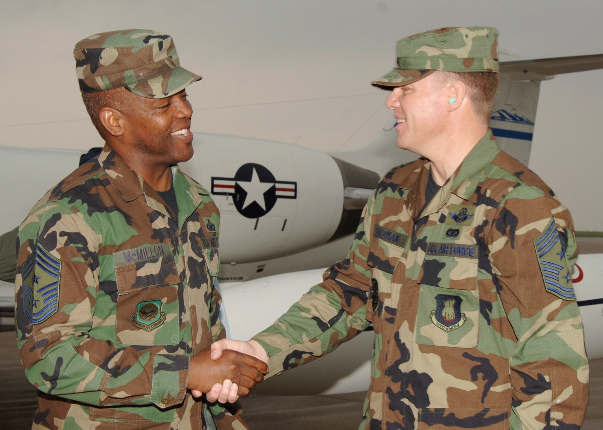 Chief Master Sgt. Todd Salzman, right, 22nd Air Refueling Wing command chief master sergeant, greets Chief Master Sgt. Brye McMillon, 18th Air Force command chief master sergeant, as he arrives at McConnell April 24. Chief McMillon accompanied Maj. Gen. James A. Hawkins, 18th Air Force commander, and the general’s wife, Linda, as they visited McConnell from Scott Air Force Base, Ill., April 24 to 26. (Photo by Airman 1st Class Jessica Corob)