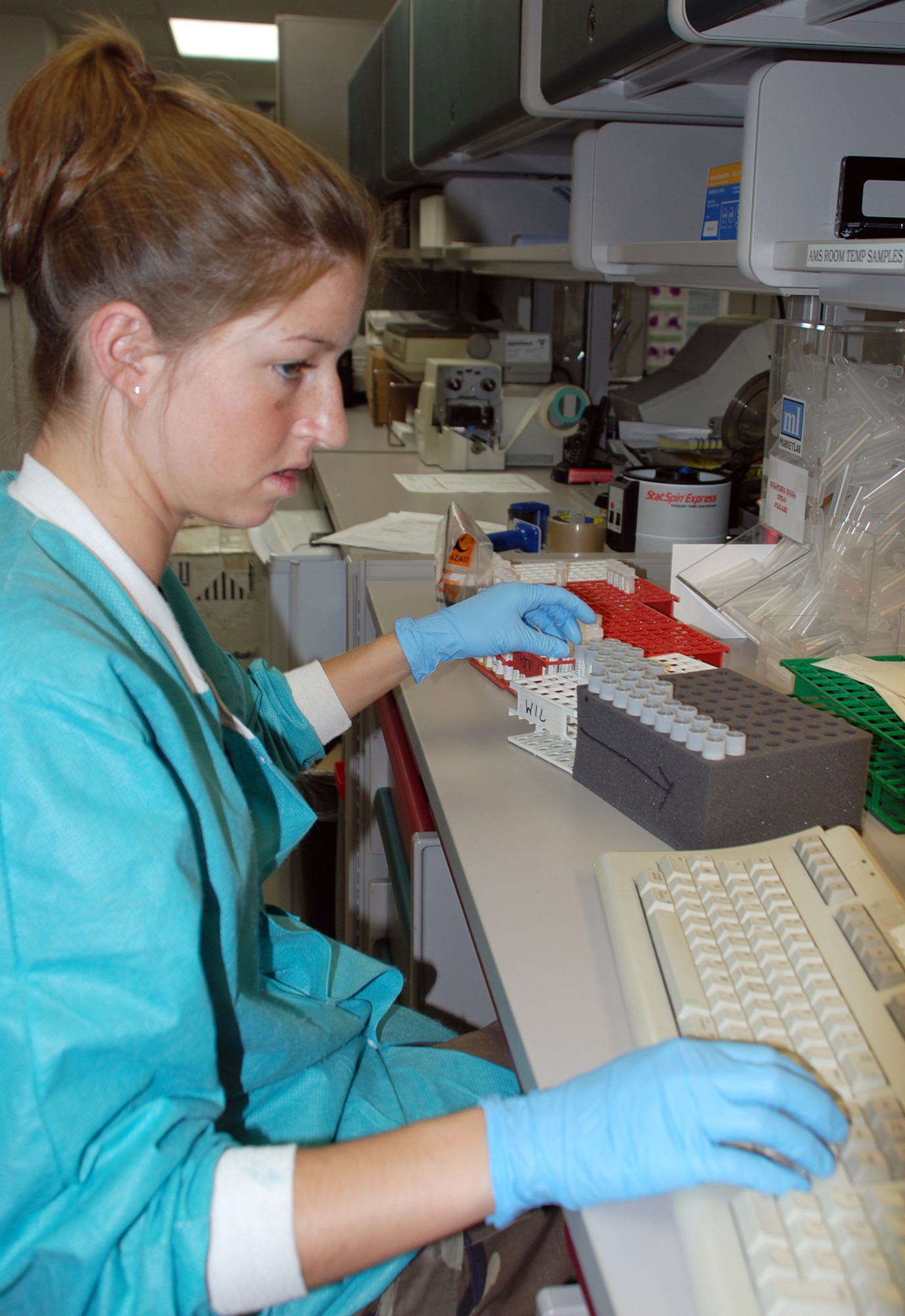 Senior Airman McKenna Anderson, a 22nd Medical Support Squadron lab technician, prepares some specimens here April 24 for shipping to medical centers such as Wilford Hall Medical Center, Lackland Air Force Base, Texas, and to Affiliated Medical Services for further analysis. (Photo by Airman 1st Class Jessica Lockoski)