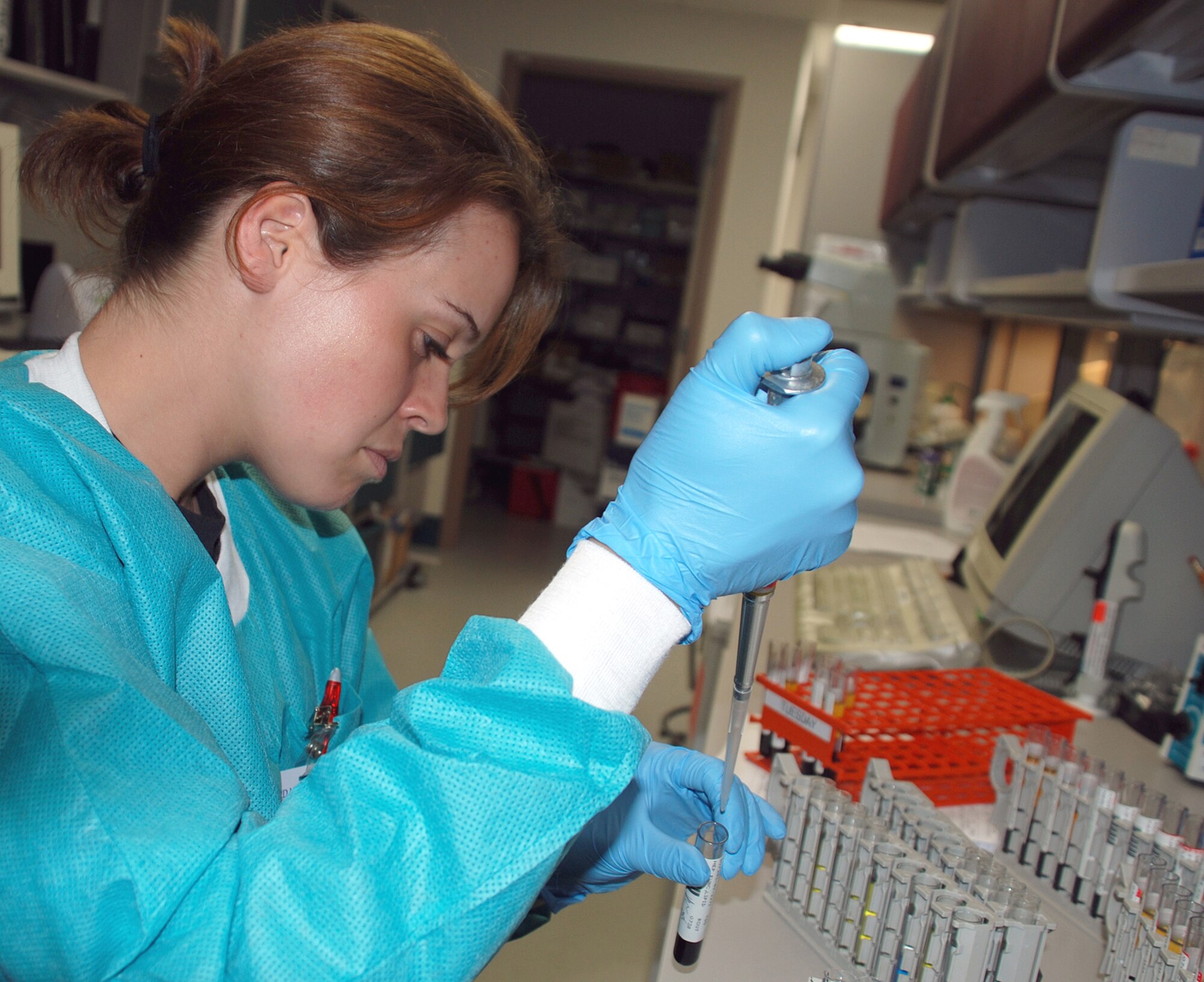 Airman 1st Class Kyle Mills, a 22nd Medical Support Squadron lab technician, sets up a High Density Lipoprotein chemistry test April 24 at the laboratory here. HDL’s are a part of a three-component lipid panel that test cholesterol levels. (Photo by Airman 1st Class Jessica Lockoski) 