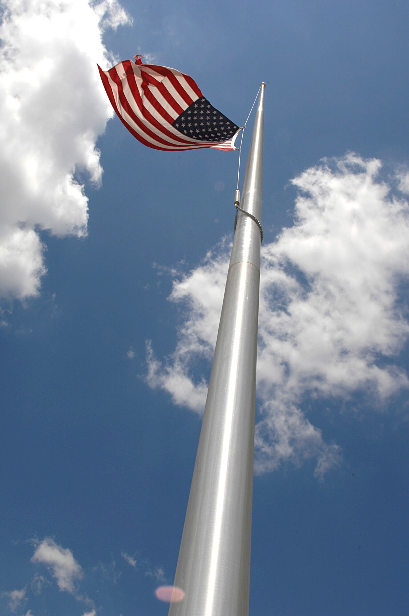 The American Flag in front of the 4th Fighter Wing Headquarters Building was placed at half-mast to pay respect for the 32 Virginia Tech students who lost their lives April 16. (U.S. Air Force photo by Senior Airman Micky Bazaldua)