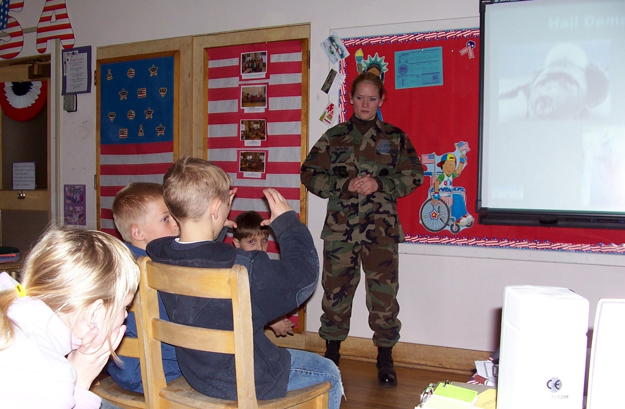 Staff Sgt. Jill Safken, 341st Operations Support Squadron weather flight forecaster, takes questions and explains weather practices at Lincoln Elementary School as part of the ‘Weather for Kids’ program.