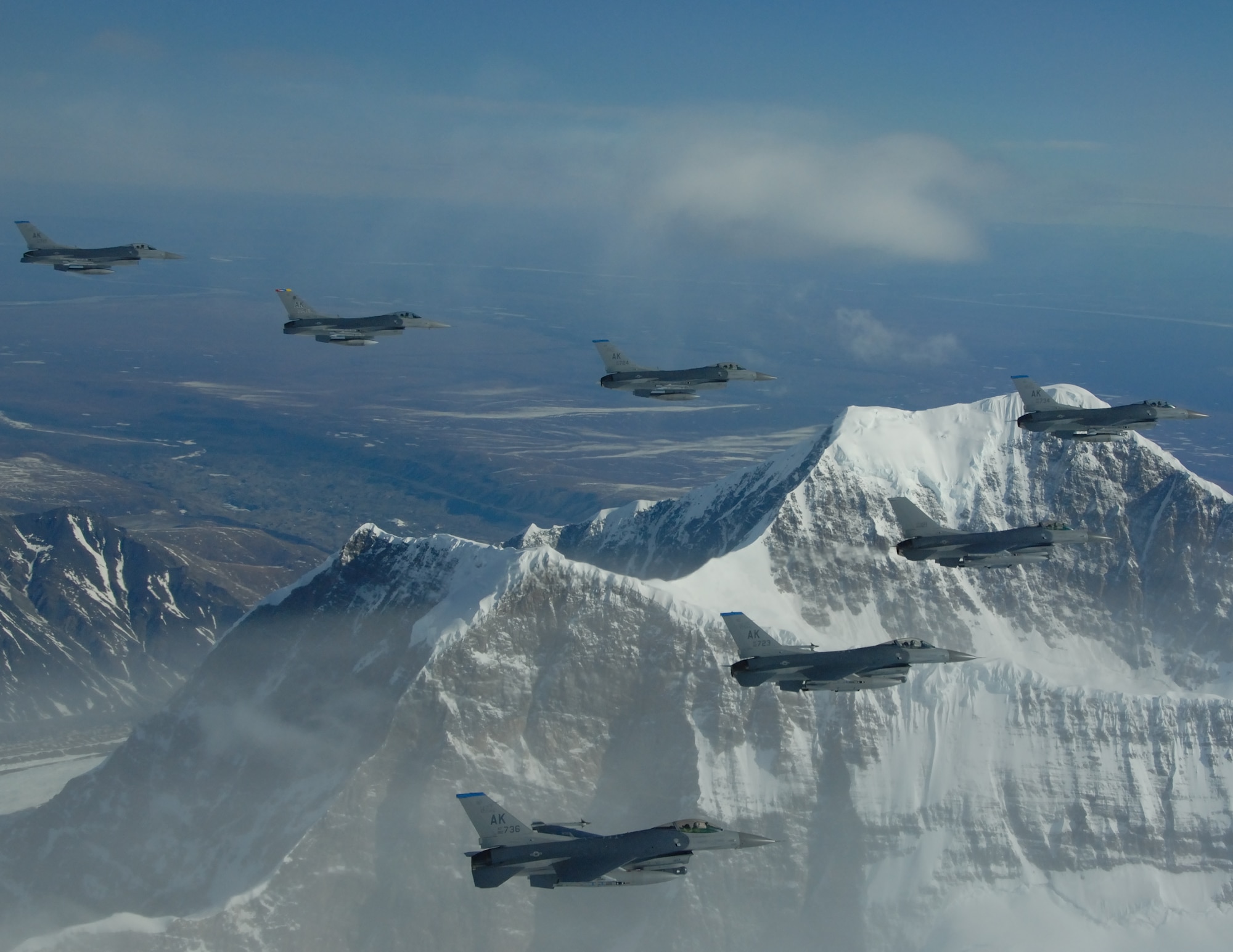 EIELSON AIR FORCE BASE, Alaska--F-16 Fighting Falcon's from the18th Fighter Squadron fly formation over the Pacific Alaska Range Complex.  The 18th Fighter Squadron conducts air operations for combat-ready F-16 aircraft, working closely with 355th Fighter Squadron to provide close air support, forward air control (airborne), battlefield air interdiction, and offensive counter air. (U.S. Air Force photo by Master Sgt. Robert Wieland)