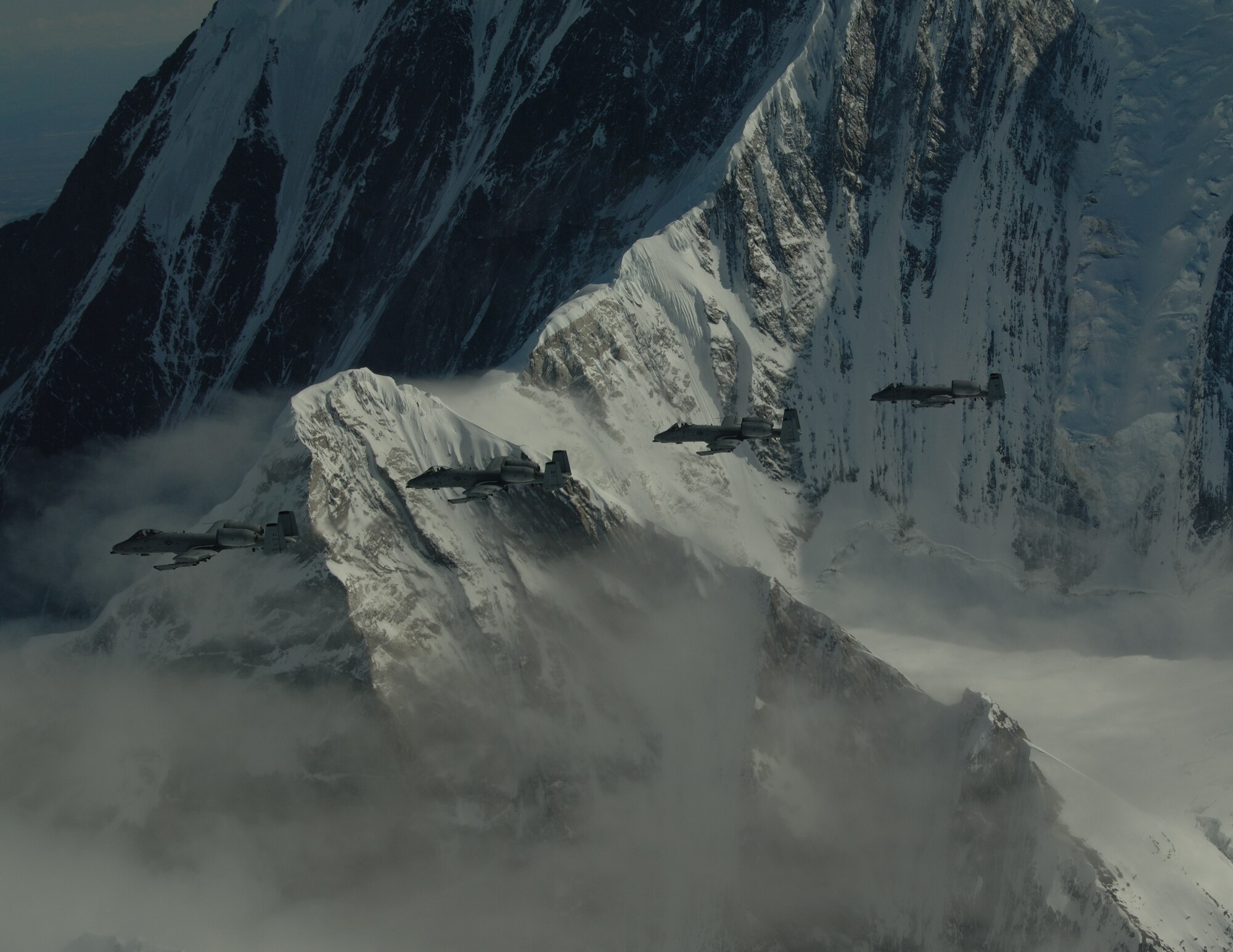 EIELSON AIR FORCE BASE, Alaska-- A/OA-10 Warthog's from the 355th Fighter Squadron fly over the Pacific Alaska Range Complex during live fire training.The 355th Fighter Squadron is tasked to provide mission ready A/OA-10s as well as search and rescue capability, in Alaska and deployed sites worldwide. (U.S. Air Force photo by Master Sgt. Robert Wieland) 