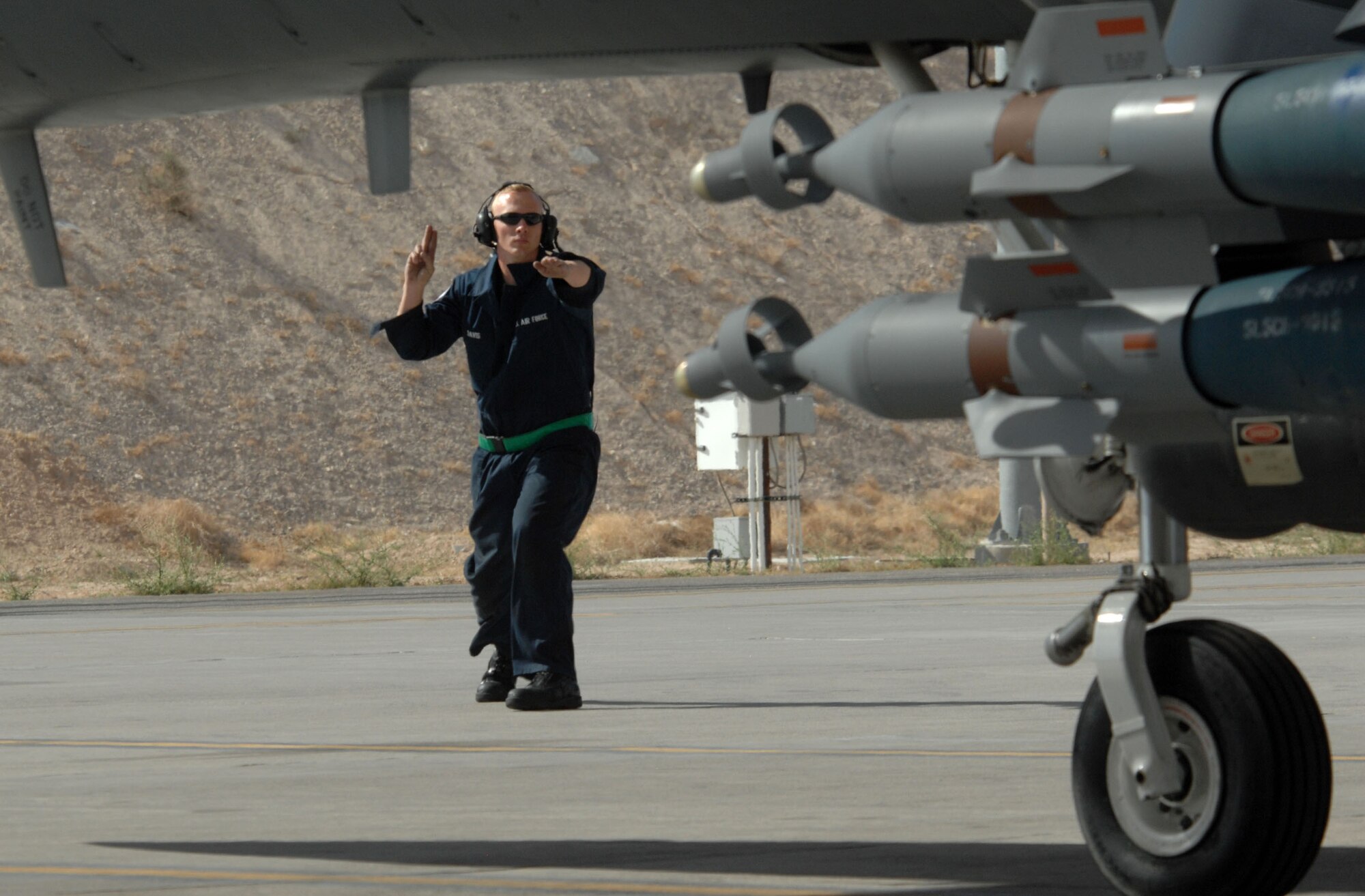Airman 1st Class Travis Davis launches an F-15E Strike Eagle April 24 at Nellis Air Force Base, Nev. Airman Davis is a crew chief assigned to the 335th Fighter Squadron from Seymour Johnson AFB, N.C. (U.S. Air Force photo/Master Sgt. Kevin J. Gruenwald)