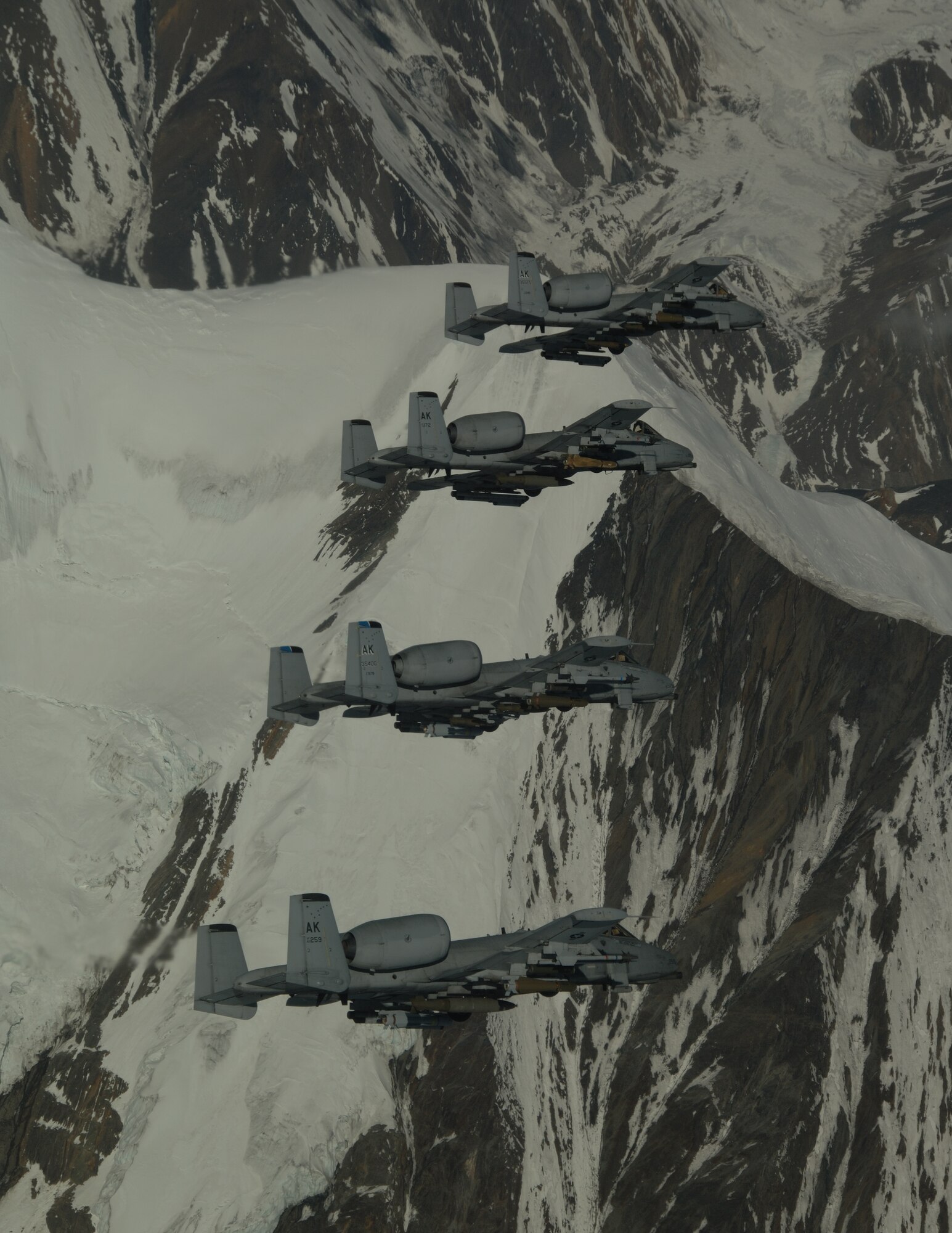 EIELSON AIR FORCE BASE, Alaska-- A/OA-10 Warthog's from the 355th Fighter Squadron fly over the Pacific Alaska Range Complex during live fire training.The 355th Fighter Squadron is tasked to provide mission ready A/OA-10s as well as search and rescue capability, in Alaska and deployed sites worldwide. (U.S. Air Force photo by Master Sgt. Robert Wieland) 