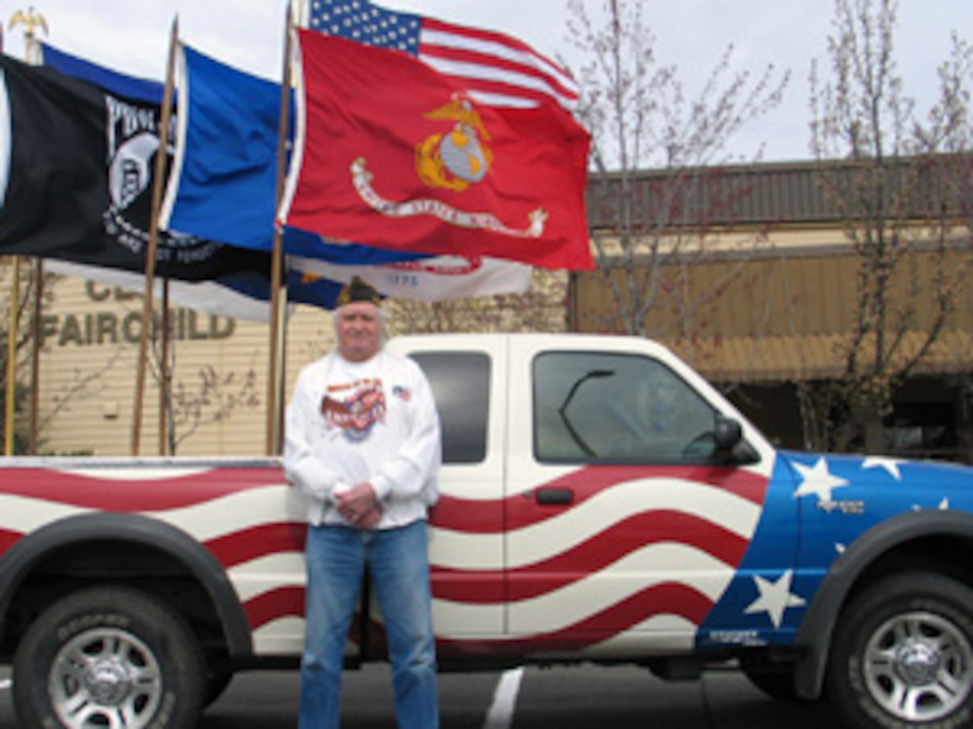 FAIRCHILD AIR FORCE BASE, Wash. – John Woods, who served as a Navy gunner’s mate in WWII and the Korean War, displays his patriotic ride in front of Club Fairchild here April 24 during Retiree Appreciation Day events. Mr. Woods, who celebrates his 82nd birthday April 27, spent 12 years in the Navy and served aboard the USS Cassin Young, now a museum ship located at the Boston Naval Shipyard in Charlestown, Mass. “Anything related to the military and our flag, I just love,” he said. (U.S. Air Force photo/Staff Sgt. Connie L. Bias)