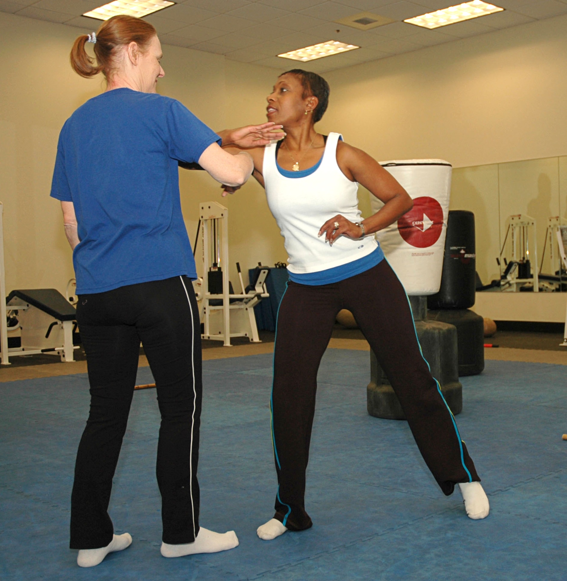 MOUNTAIN HOME AIR FORCE BASE, Idaho -- From left, Karen Vachon and Gloria Valdez, both from 366th Civil Engineer Squadron base housing office, practice their moves during a self-defense class April 24 at the base fitness center.  The classes were part of sexual assault awareness month events sponsored by the base's sexual assault response coordinator. Air Force photo by Airman Samantha S. DeVries