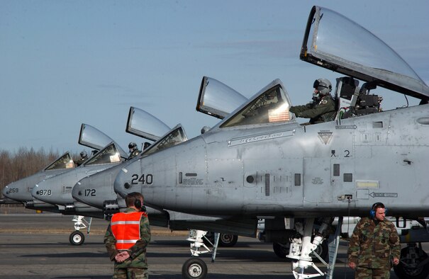 Four A-10 Thunderbolt IIs with the 355th Fighter Squadron are parked in position at the end of runway to be armed by Airmen from the 354th Aircraft Maintenance Squadron on April 24 at Eielson Air Force Base, Alaska. Due to the Base Realignment and Closure list the A-10 Thunderbolt II is being relocated to Moody AFB, Ga. (U.S. Air Force photo/Airman 1st Class Jonathan Snyder)
