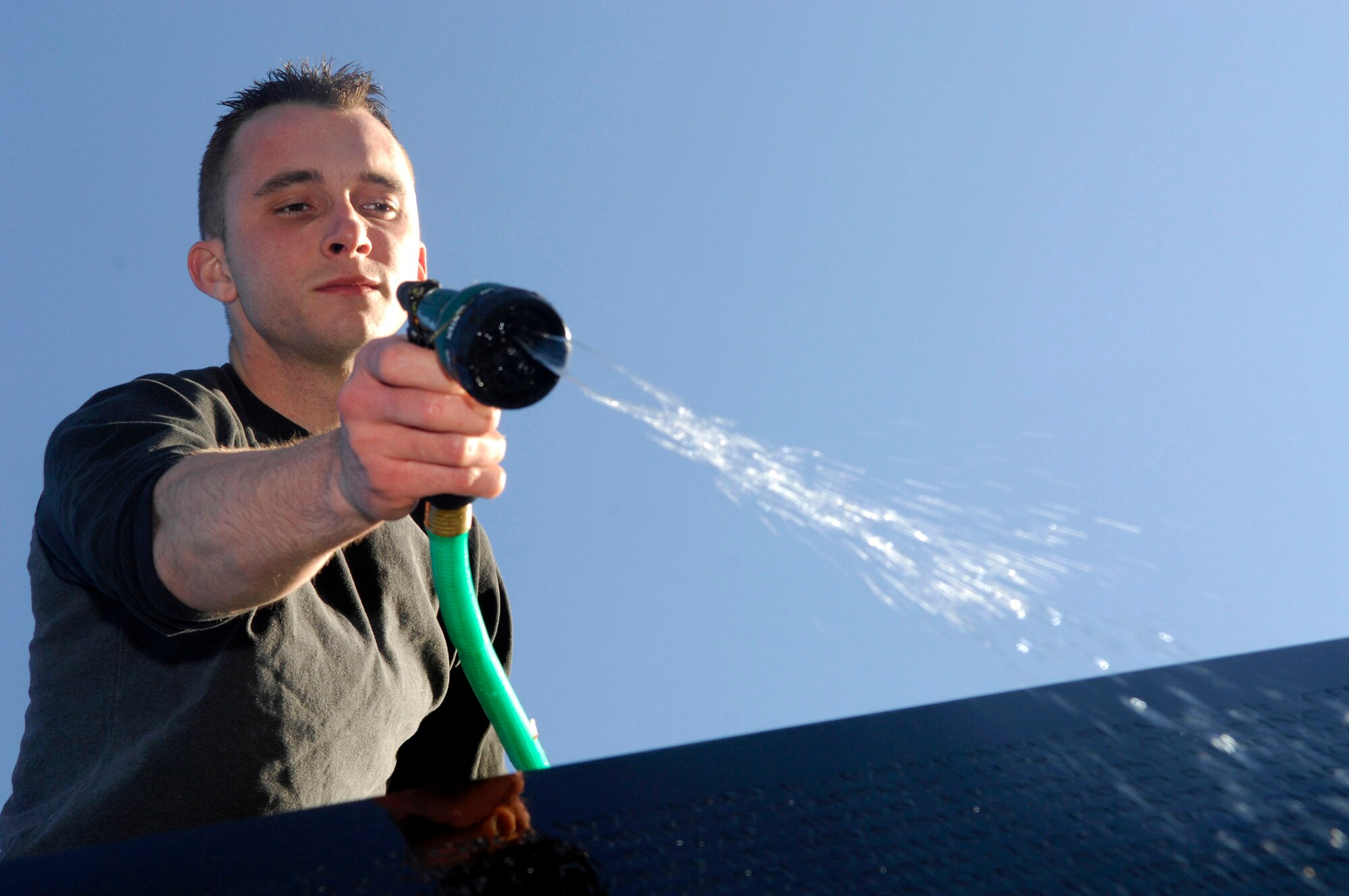 Senior Airman Travis Fitzgerald cleans the Vietnam Veterans Memorial during a volunteer cleaning project in Washington, D.C., April 21. Members of the Air Force Sergeants Association, with volunteers from Charleston, Shaw, Pope, Seymour Johnson, Langley and Bolling Air Force Bases, were among those who helped in the project. Airman Fitzgerald is assigned to Langley AFB, Va. (U.S. Air Force photo/Tech. Sgt. Cohen A. Young) 