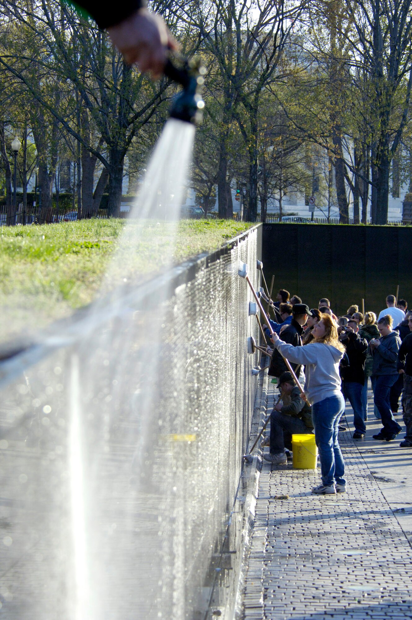 Members of the Air Force Sergeants Association clean the Vietnam Veterans Memorial in Washington, D.C., April 21.  Volunteers from Charleston, Shaw, Pope, Seymour Johnson, Langley and Bolling Air Force Bases were among those who participated in the event. (U.S. Air Force photo/Tech. Sgt. Cohen A. Young) 