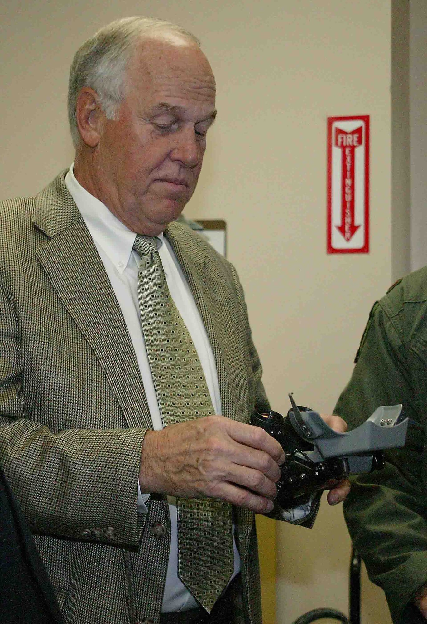 SHAW AIR FORCE BASE, S.C. -- John Peebles, president of the 20th Fighter Wing Association, reviews a pair of night-vision goggles April 23 during a tour of the 55th Fighter Squadron. During the visit, Mr. Peebles also met with wing leaders and other fighter pilots. The 20th FW Association is composed of former members of the wing, its subordinate organizations and its predecessors to promote the history of the unit. The 20th FW traces its lineage to the 20th Pursuit Group which was later absorbed by the 20th Fighter Bomber Wing. The 20th was one of the 13 original combat air groups formed by the Army before World War II.  (U.S. Air Force photo/Senior Airman John Gordinier)