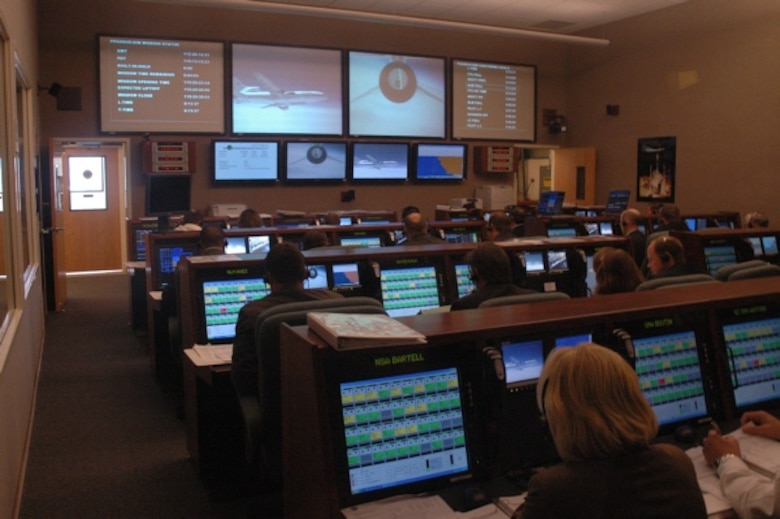 A government-industry team monitors events from the NASA launch control room in building 836 at Vandenberg April 25, when an L-1011 aircraft launched NASA’s Aeronomy of Ice in the Mesosphere spacecraft into orbit.  Large screens at the front of the room show a view of the L-1011 launch aircraft from an F/A-18 chase plane and a view of the back end of the rocket from a camera under the L-1011. (Courtesy photo)