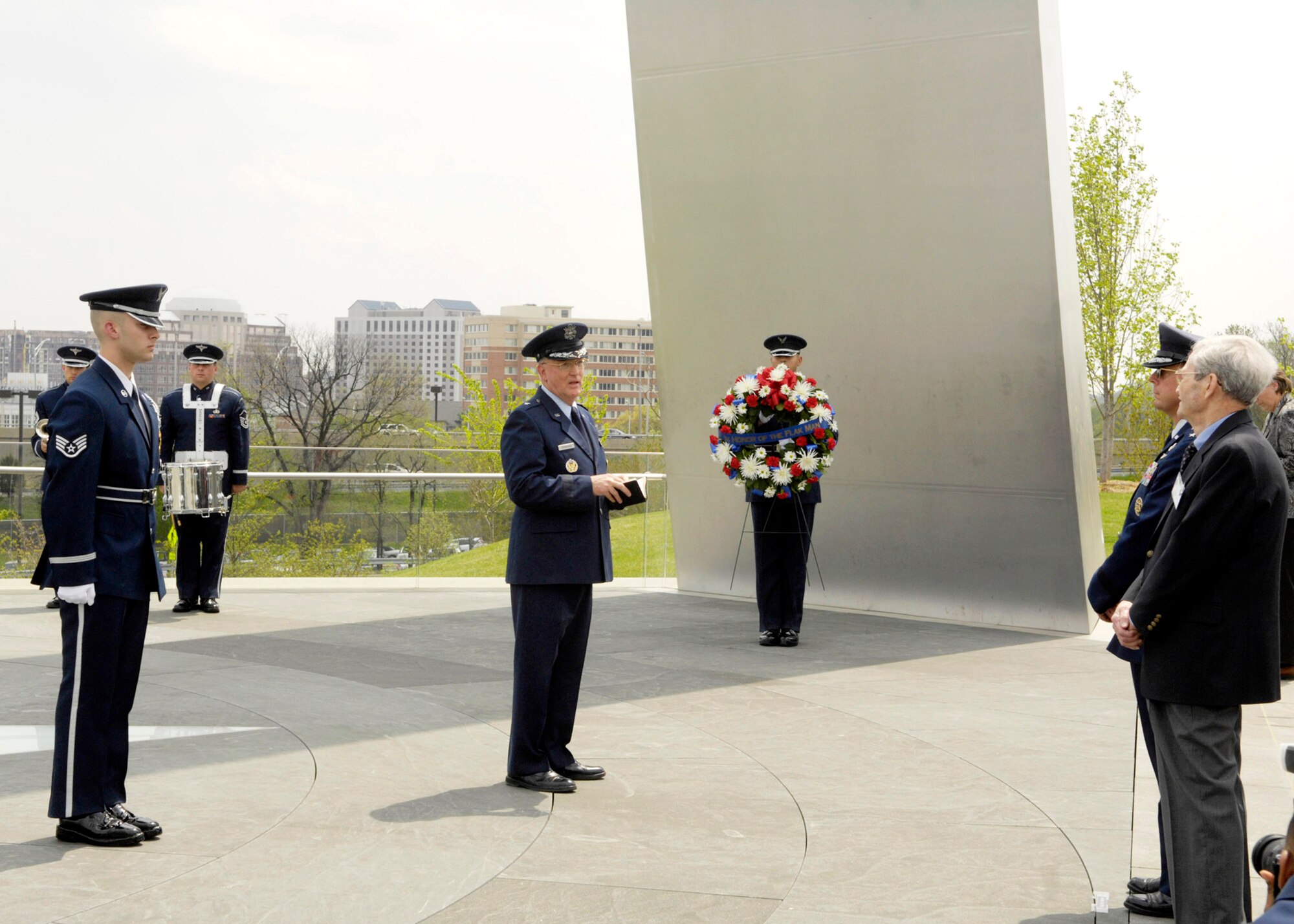 A wreath-laying ceremony in honor of the "Flak Man" B-24 Liberator crew was held April 24 in Washington, D.C.The bomber crew members were also awarded the Distinguished Flying Cross 63 years after their encounter with heavy anti-aircraft fire July 15, 1944. Despite losing one engine, the crew managed to complete their mission by bombing the Nazi's oil refinery lifeline in Romania. They were shot down the next day while participating in a raid over Austria and were taken prisoner of war.(U.S. Air Force photo/Senior Airman Rusti Caraker)