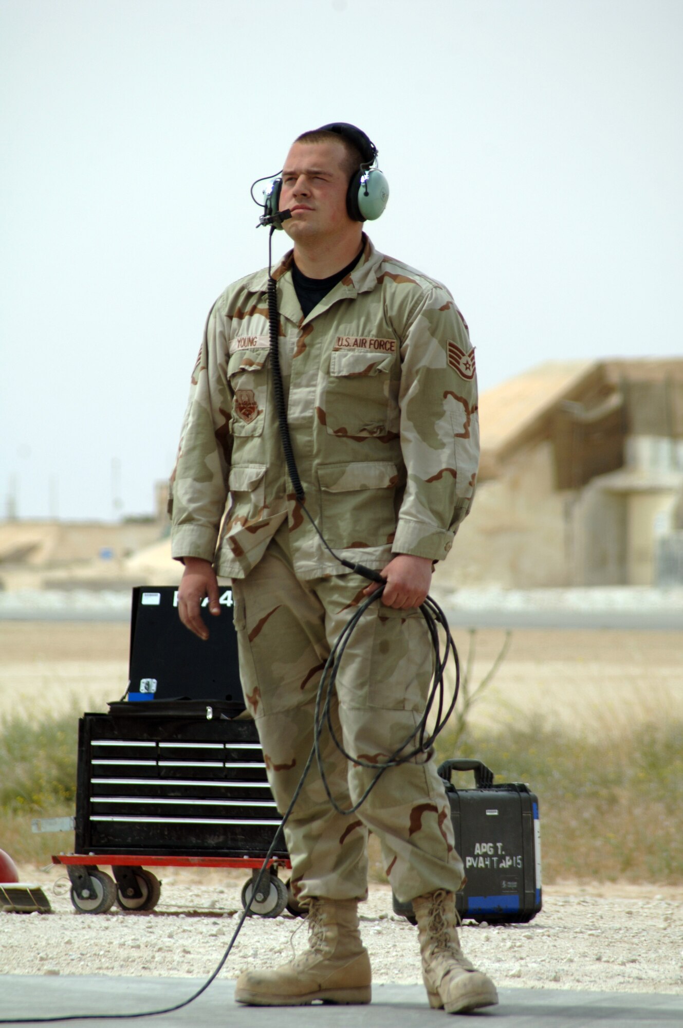 AL ASAD AIR BASE, Iraq — Phenix City, Ala. native crew chief Staff Sgt. Steve Young goes through pre-flight checks with A-10 pilot 1st Lt. Chris "Harpoon" Laird, both with the 438th Air Expeditionary Group, in preparation for a combat mission over Al Anbar Province in western Iraq. The group activated here Jan. 15, 2007, to provide close air support for Coalition Forces in the region. Within hours of standing up as a fully operational combat flying unit, the group was launching its fierce 'Warthogs' into battle. Since activating, the group has flown some 2,648 flying hours on 820 combat sorties providing CAS in some of the most challenging urban terrain in Iraq including Fallujah, Ramadi, Baghdad and Baquba, overcoming communications jams inherent in operations there, and remaining focused, vigilant and effective against a determined enemy. (U.S. Air Force photo/Capt. Ken Hall)