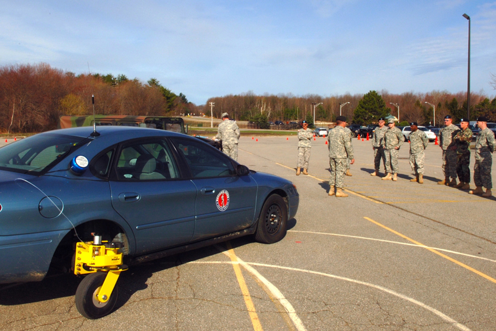 U.S. Army servicemembers observe a demonstration April 25 of the Skid Monster, a device attached to the back of a car that can be controlled by remote. The device teaches drivers how to handle cars that become out of control due to driving on snow, ice, sand or other difficult driving surfaces. The demonstration was part of the 2007 Spring Regional Safety and Occupational Health Conference that took place on base April 23 through 27. (US Air Force photo by Jan Abate)
