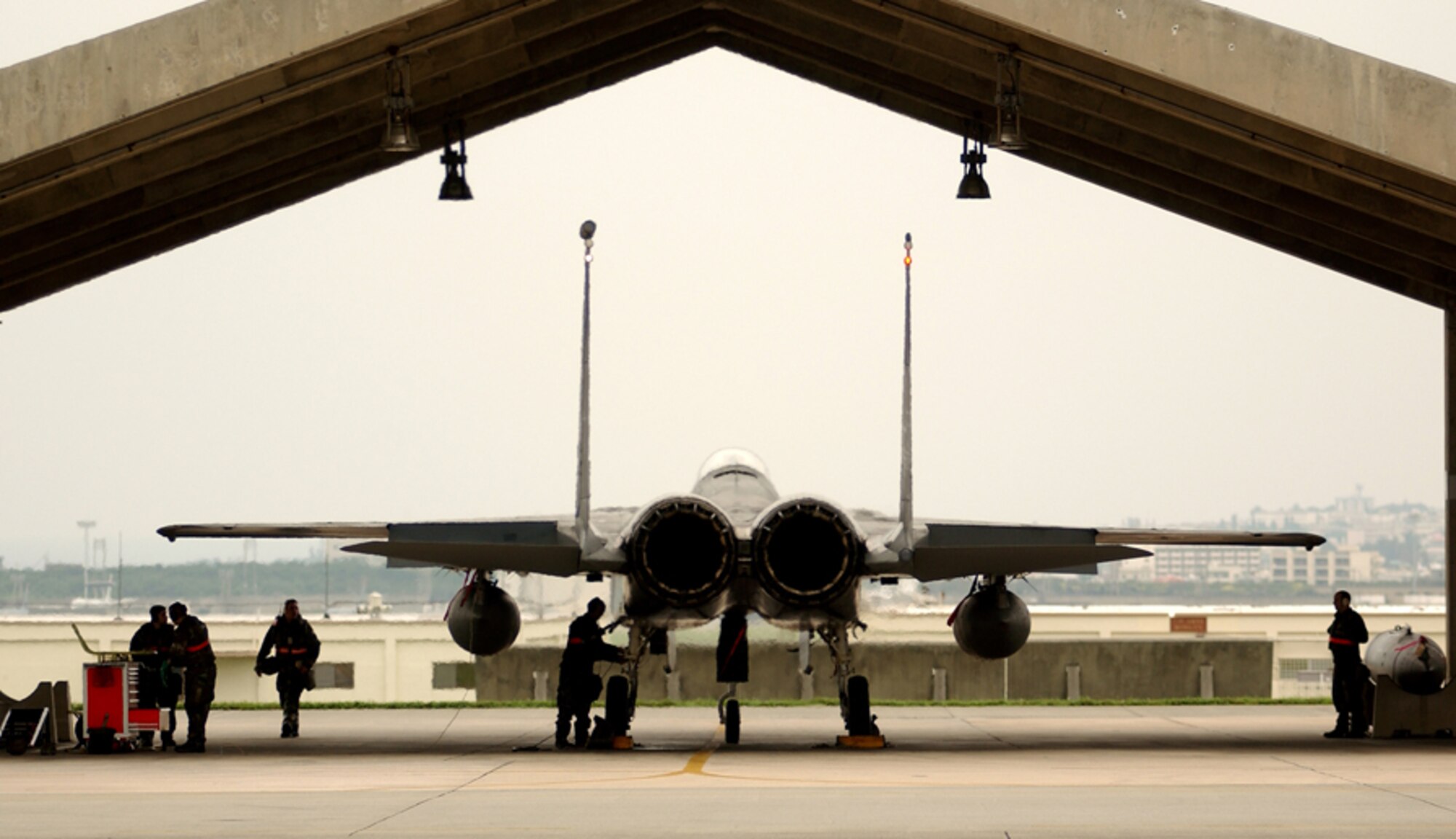 070426-F-5435R-047
KADENA AIR BASE, Japan -- A maintenance crew from the 18th Aircraft Maintenance Squadron recover an F-15C after a simulated combat sortie.  This was part of week-long exercise activities designed to test the wing's ability to mobilize personnel and cargo, respond to crises, and project combat airpower.  (U.S. Air Force photo by Staff Sgt. Reynaldo Ramon)