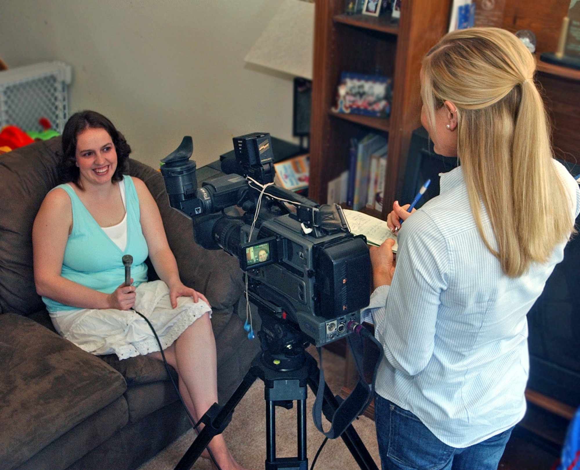 Heather Kangas, one of 10 finalists on the ABC network's "Good Morning America Dancing with the Moms challenge," is interviewed in her home at Eielson Air Force Base, Alaska, April 25 by Dana Markland, a reporter with a local ABC affiliate.  Mrs. Kangas, wife of Staff Sgt. Matt Kangas from the 354th Logistics Readiness Squadron, entered the contest "on a whim" because she and her children always dance around the house.  (U.S. Air Force photo/Senior Airman Justin Weaver)
