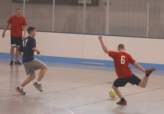 GRAND FORKS AIR FORCE BASE, ND – A 319th Maintenance Squadron offensive player attempts to score against the 319th Operations Support Squadron defender during intramural soccer here April 19. Unfortunately, MXS was unable to collect on any attempts to score against the OSS defensive phalanx. (U.S. Air Force photo/Senior Airman J. Paul Croxon)

