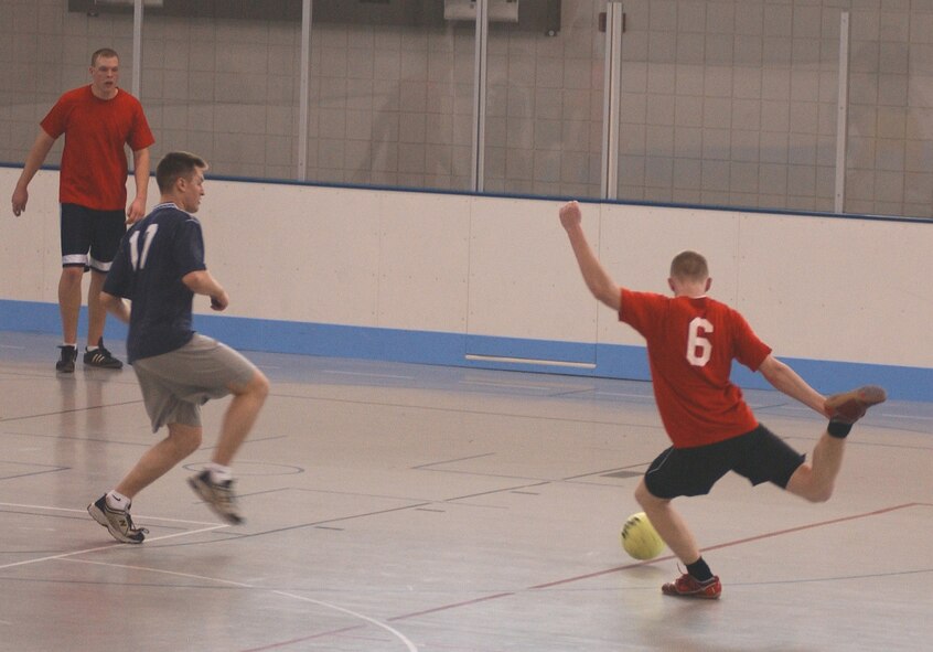 GRAND FORKS AIR FORCE BASE, ND – A 319th Maintenance Squadron offensive player attempts to score against the 319th Operations Support Squadron defender during intramural soccer here April 19. Unfortunately, MXS was unable to collect on any attempts to score against the OSS defensive phalanx. (U.S. Air Force photo/Senior Airman J. Paul Croxon)
